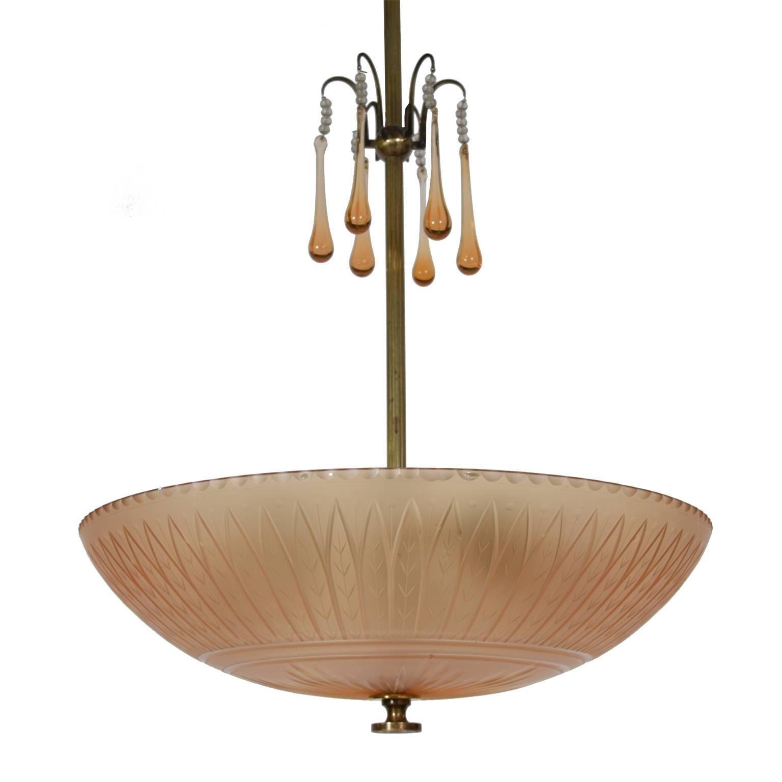 Cut and polished satin shade in rio brown glass. Oxidized brass fittings and six drop glass ornaments.
