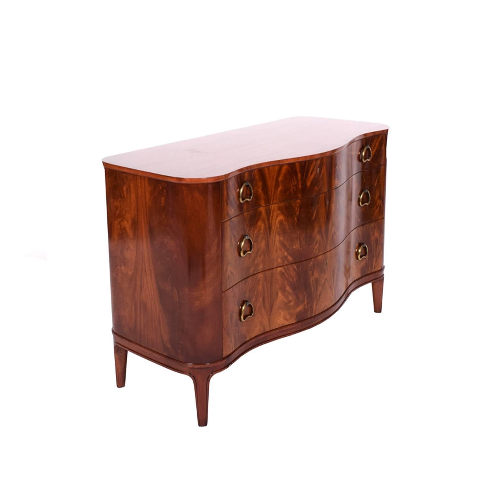 Flame mahogany free-form chest of drawers designed by Axel Larsson for Bodafors, 1940s; retains label in drawer.