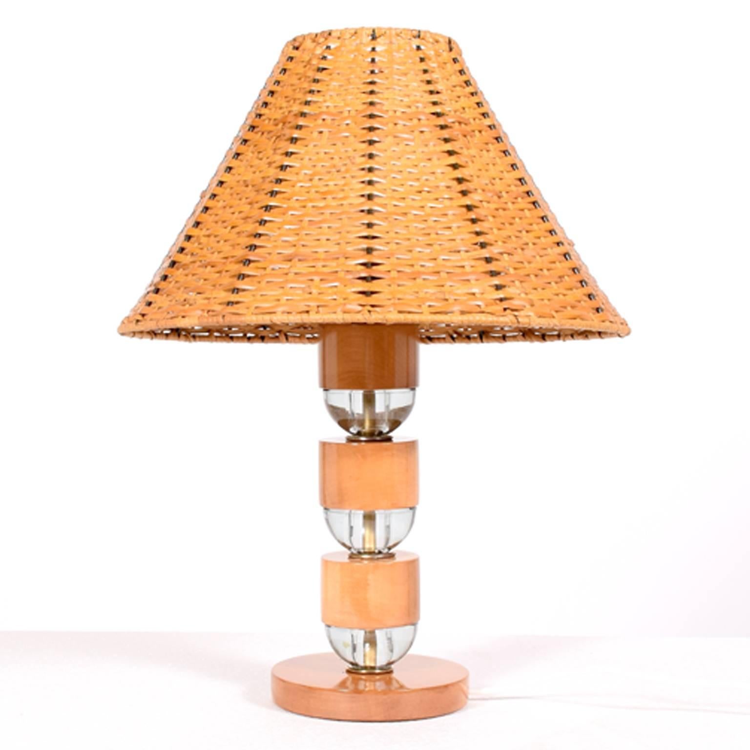 Base made of solid maple and glass spacers with cane lampshade. Wood has been restored, rest is all original.