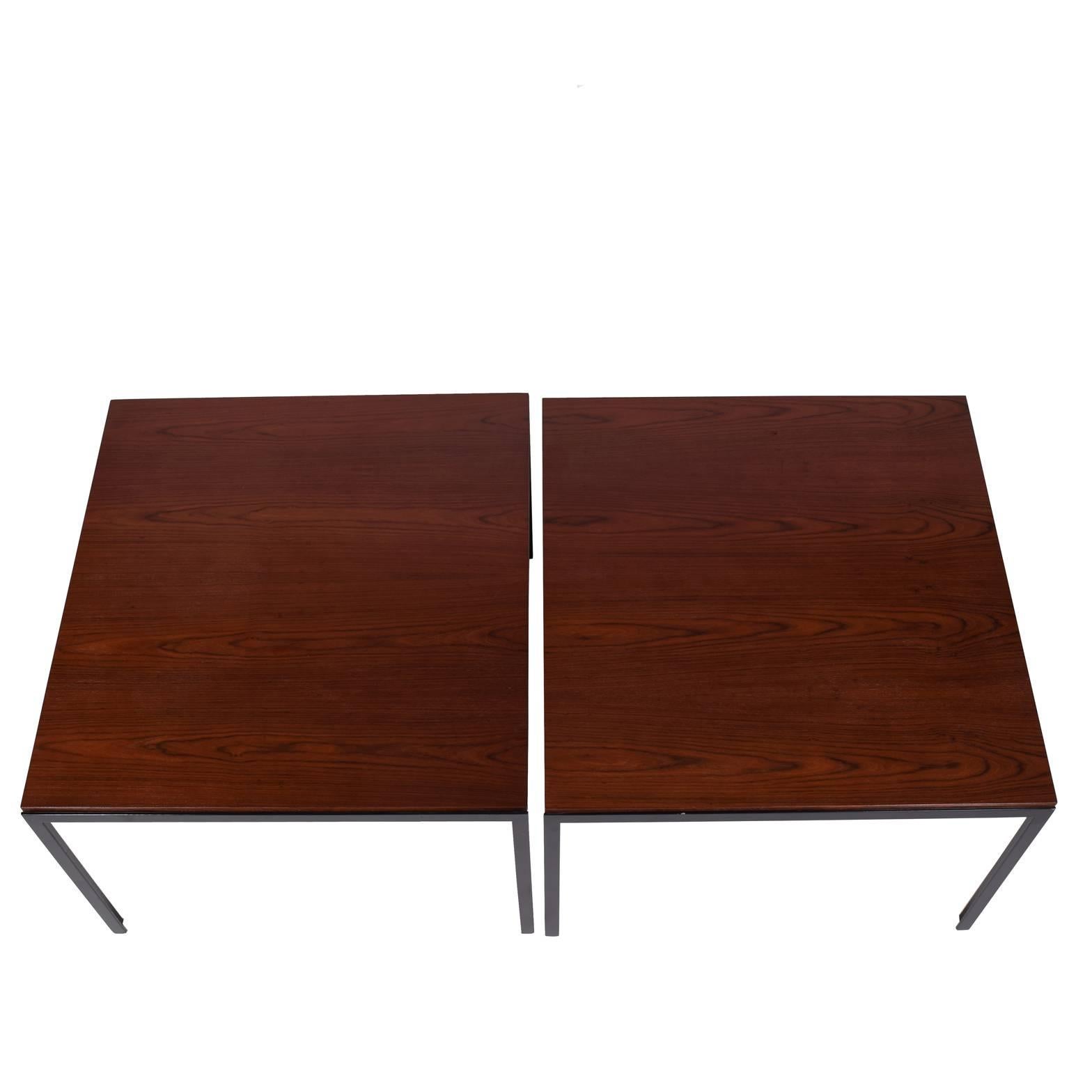 Pair of side tables with black enamel painted flat metal frame and rosewood top. Made by Knoll Associates.