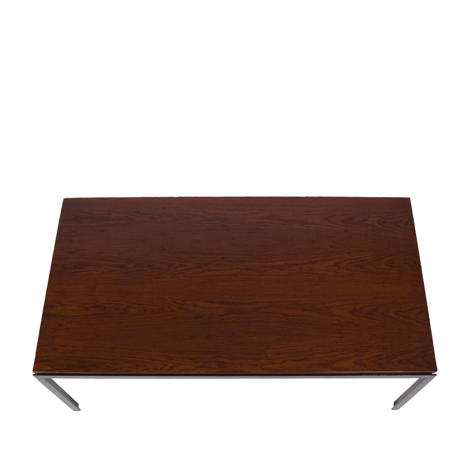 Rectangular table with black enamel painted black steel frame and rosewood top.
Made by Knoll.