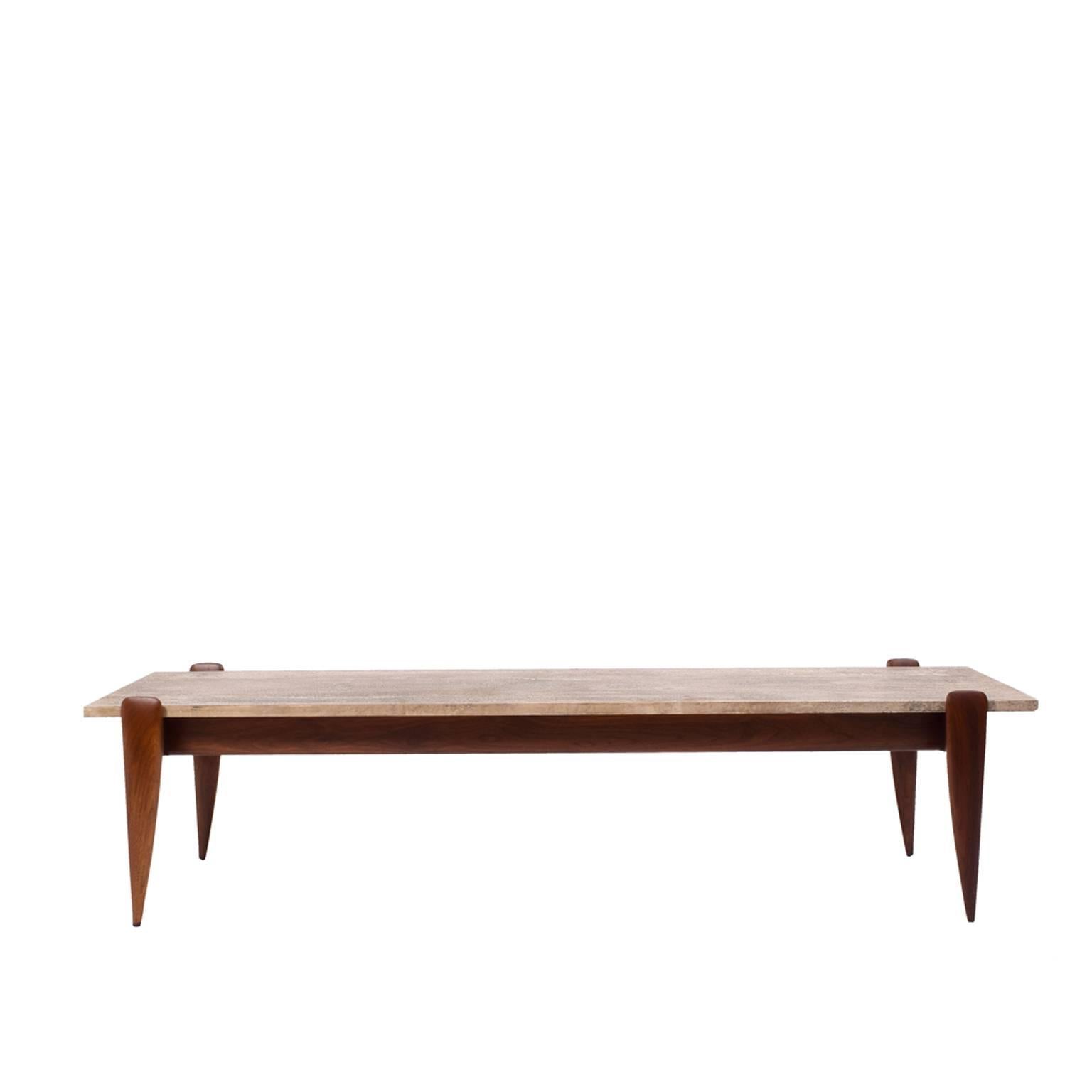 Model # 2137, solid walnut base with travertine top. Curved and tapered legs. Retains paper label,
M. Singer and Sons.