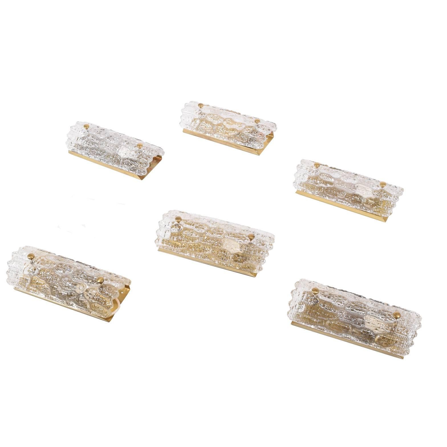 Set of six clear glass and solid brass back scones, design by Carl Fagerlund for Orrefors.