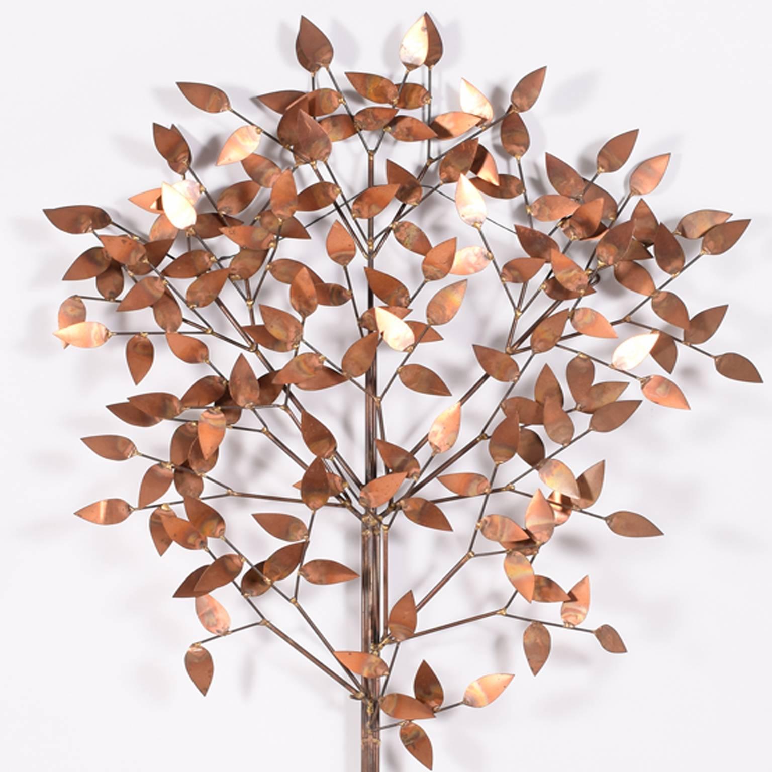 Signed: c jere; wall-mounted sculpture of a tree in copper.