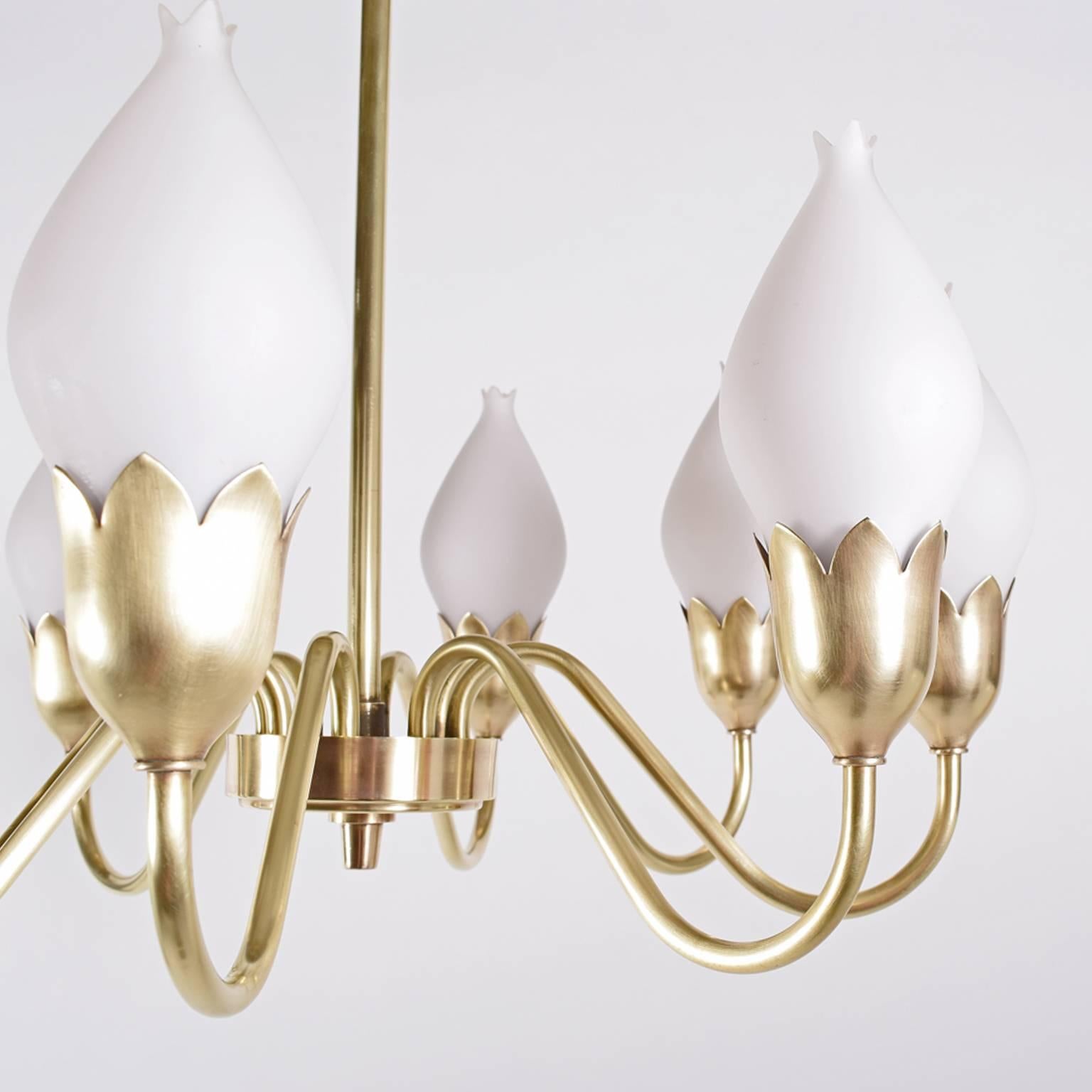 Signed Fog & Mørup. Solid brass chandelier with eight arms and opal glass.