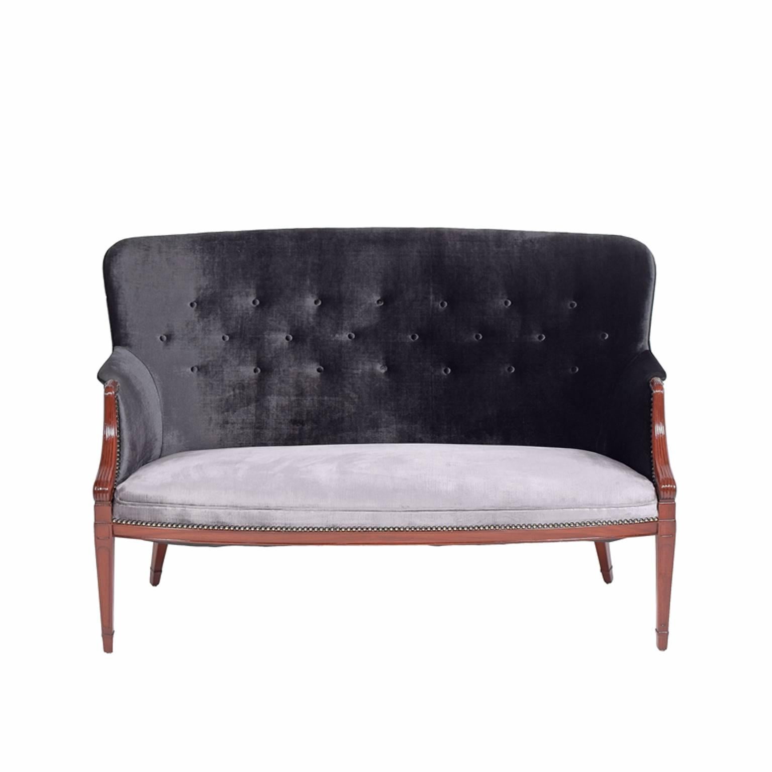 Solid mahogany two-seat sofa designed and made by Frits Henningsen in the 1940s. Two-tone velour upholstery with black upper and silver seat.