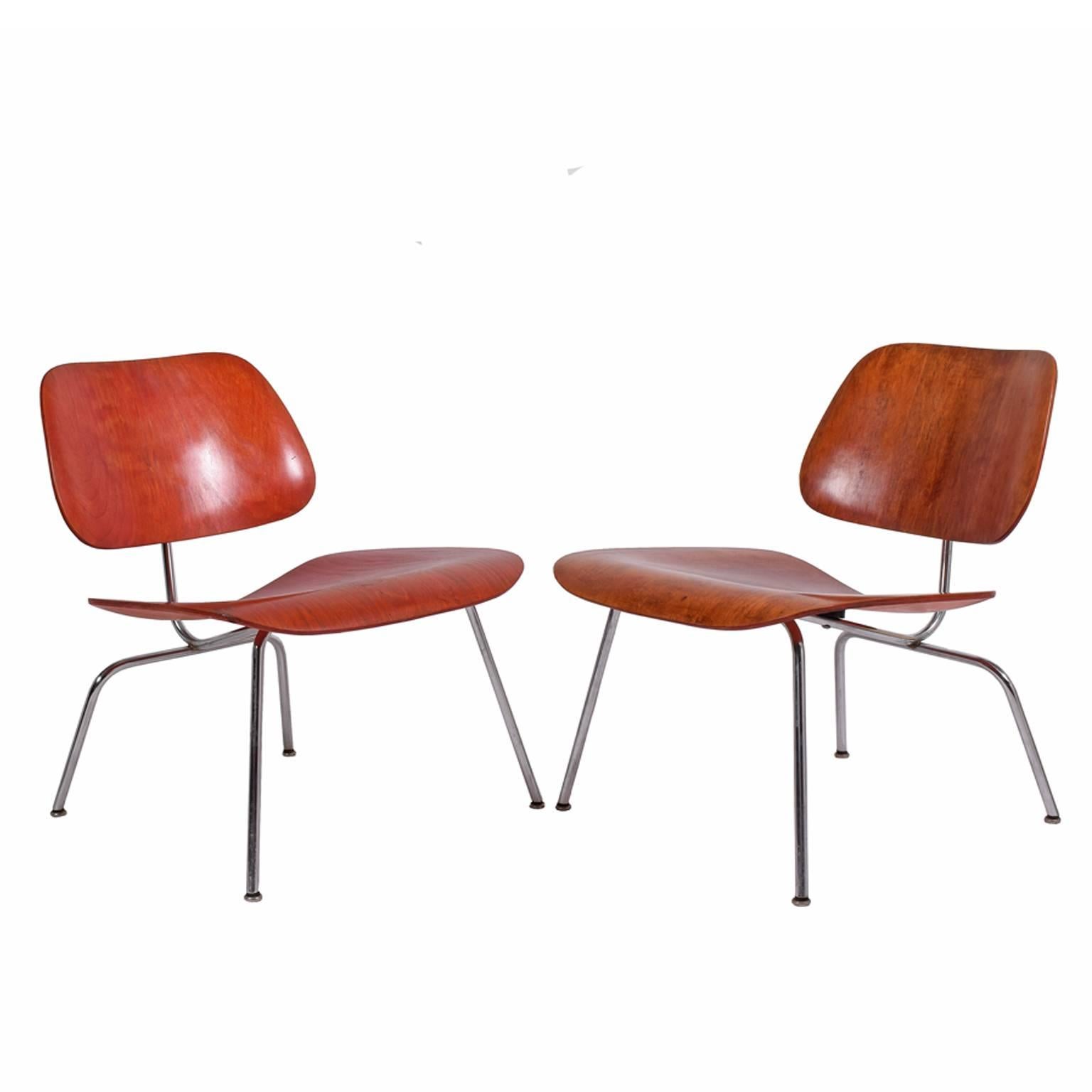 1950s  easy lounge chairs play wood backs and seats on solid steel bases, Early production.

