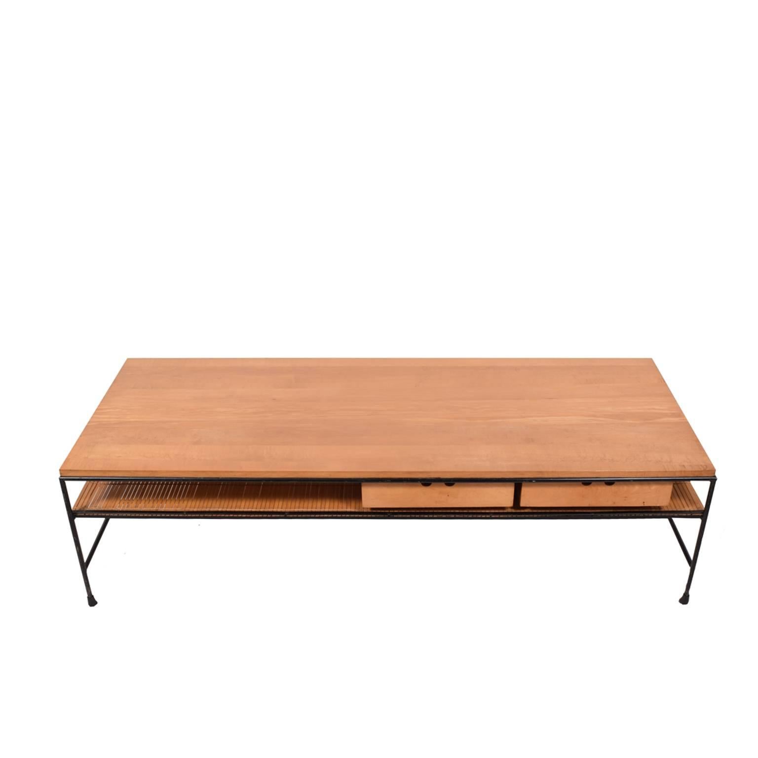 Maple top with two suspended drawers on solid black painted iron frame. Designed by Paul McCobb in the 1950s for Winchendon.