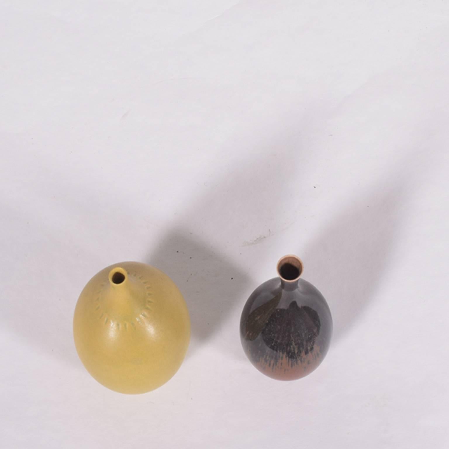 Berndt Friberg was known for his delicate and beautiful shapes and glazings. He designed about 50+ different mini vases and bowls.

Yellow vase: 4" height and 2.75 diameter.
