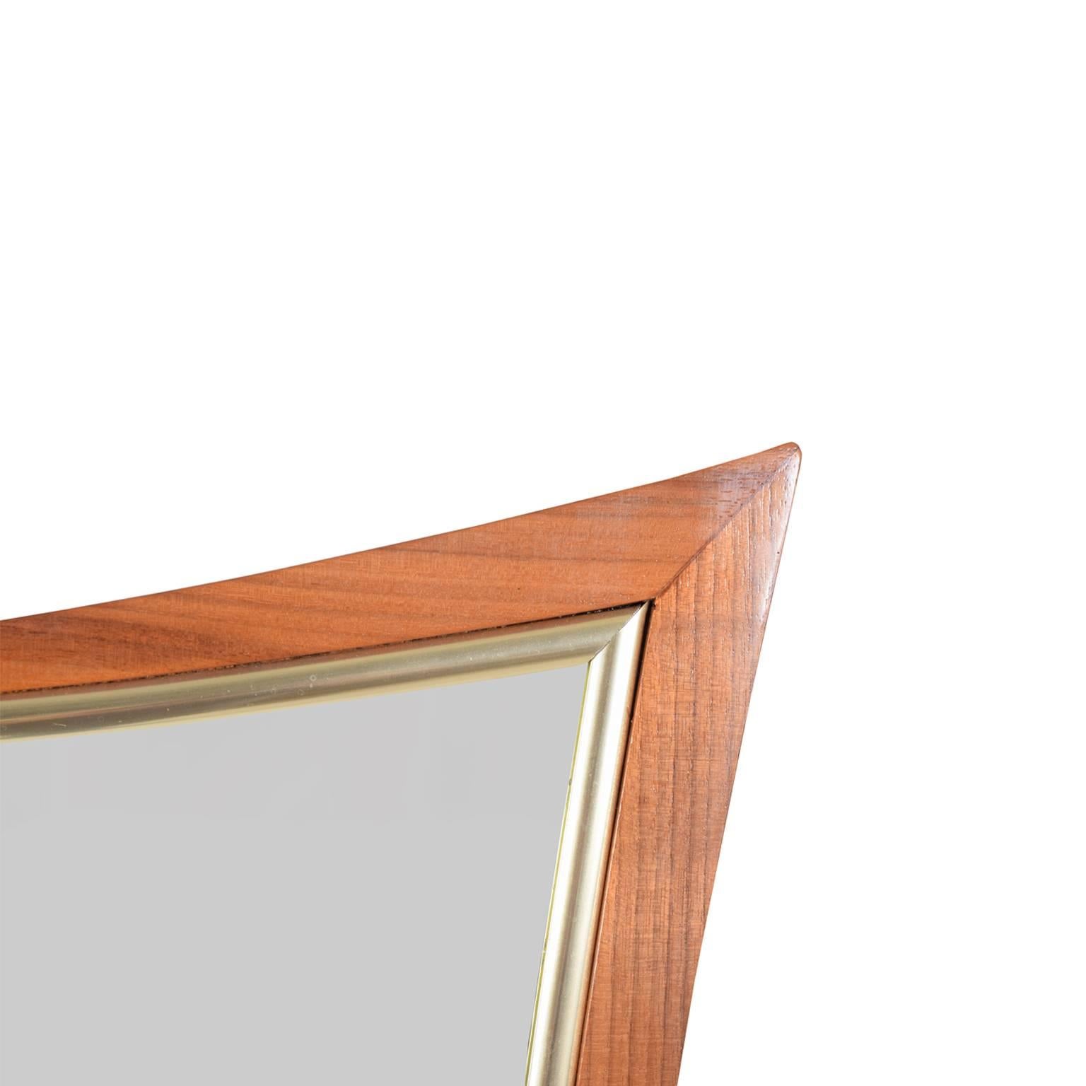 Two sculptural solid walnut and gold stained trim mirrors designed by William Hinn for Urban Furniture. Priced individually.