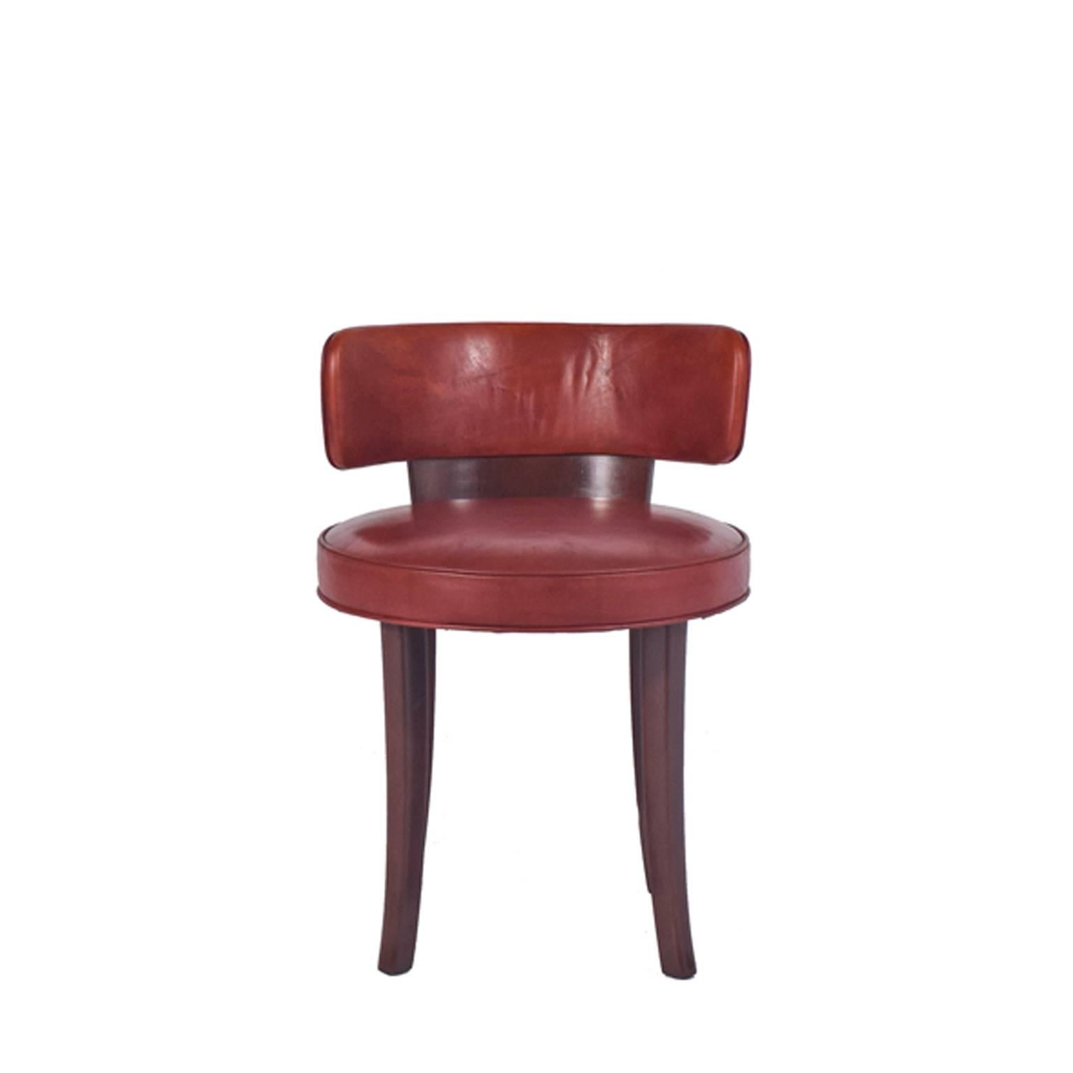 Wonderfull Vanity/Occasional quarter moon low back chair. Round seat supported on four curved mahogany stained beechwood legs with red veg cow hide upholstery.