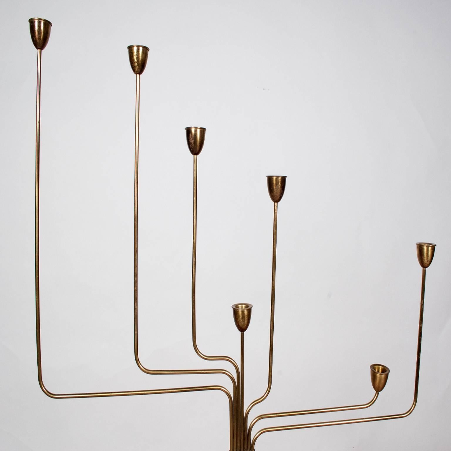 Solid brass candelabrum, created by Hein while living in Argentina. He designed this to remind him of his home in Denmark, since the star constellation is not visible in the southern hemisphere. This is the first model designed of his candelabrum;