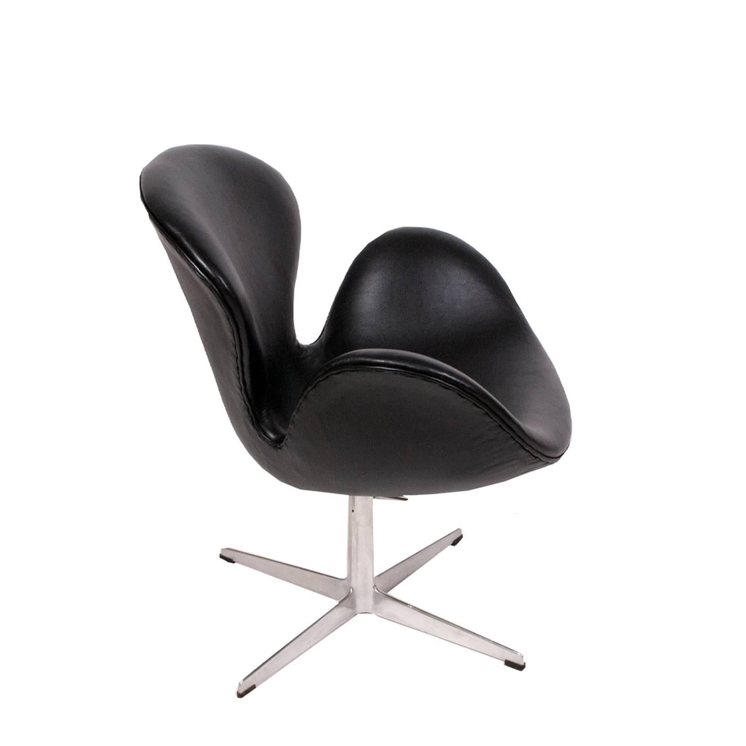 Rare version of the Swan chair; height can be adjusted from lounge to dining height. .  New leather upholstery and original aluminum base.  Made by Fritz Hansen.