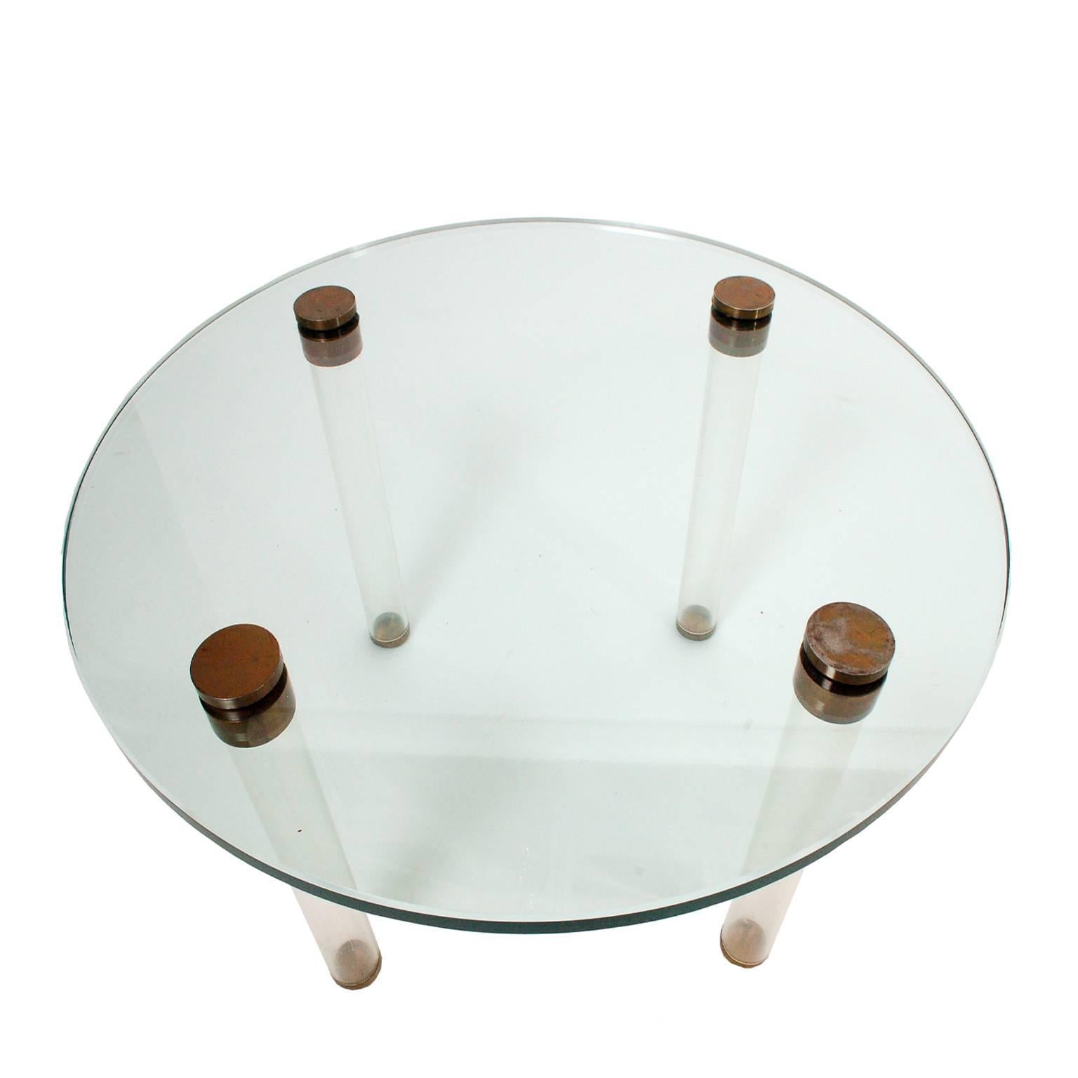 From the Luxury Group of occasional tables, this is model #3942. Round glass top on Lucite legs, metal leg attachments and glides. Innovative Rohde design for Herman Miller, 1939.