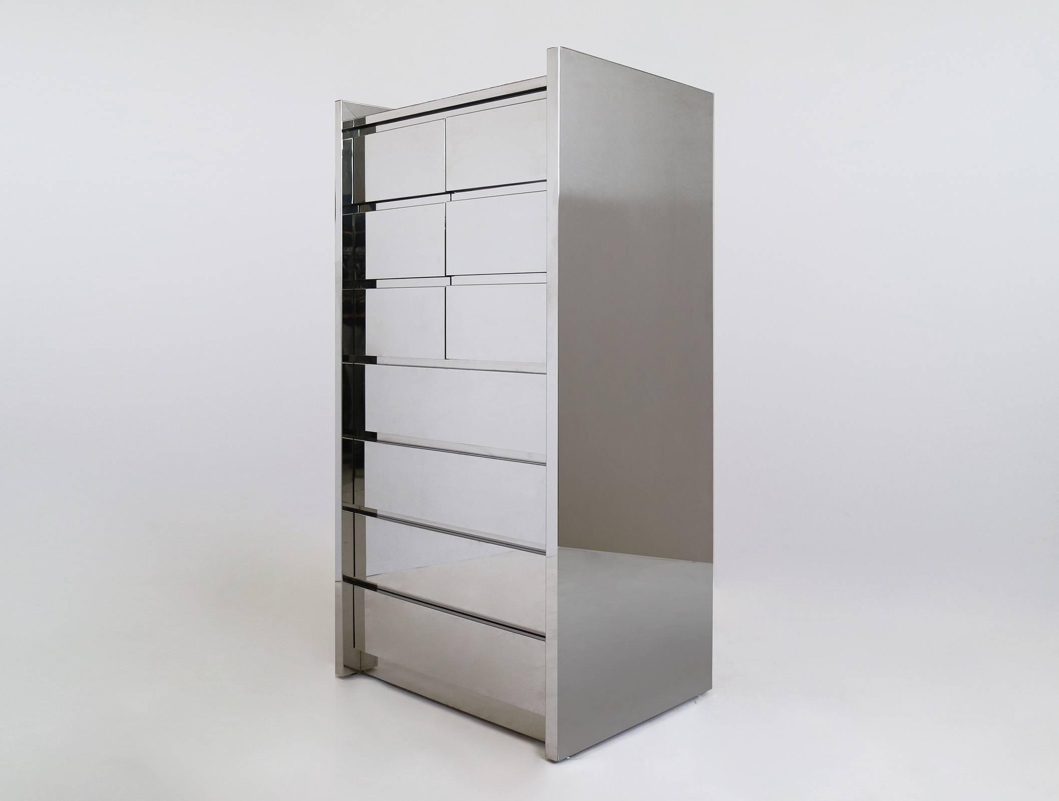 Karl Springer LTD., four drawer case with upper storage compartment, hinged doors, adjustable shelf.
High polished stainless steel with mirror glass surface top.