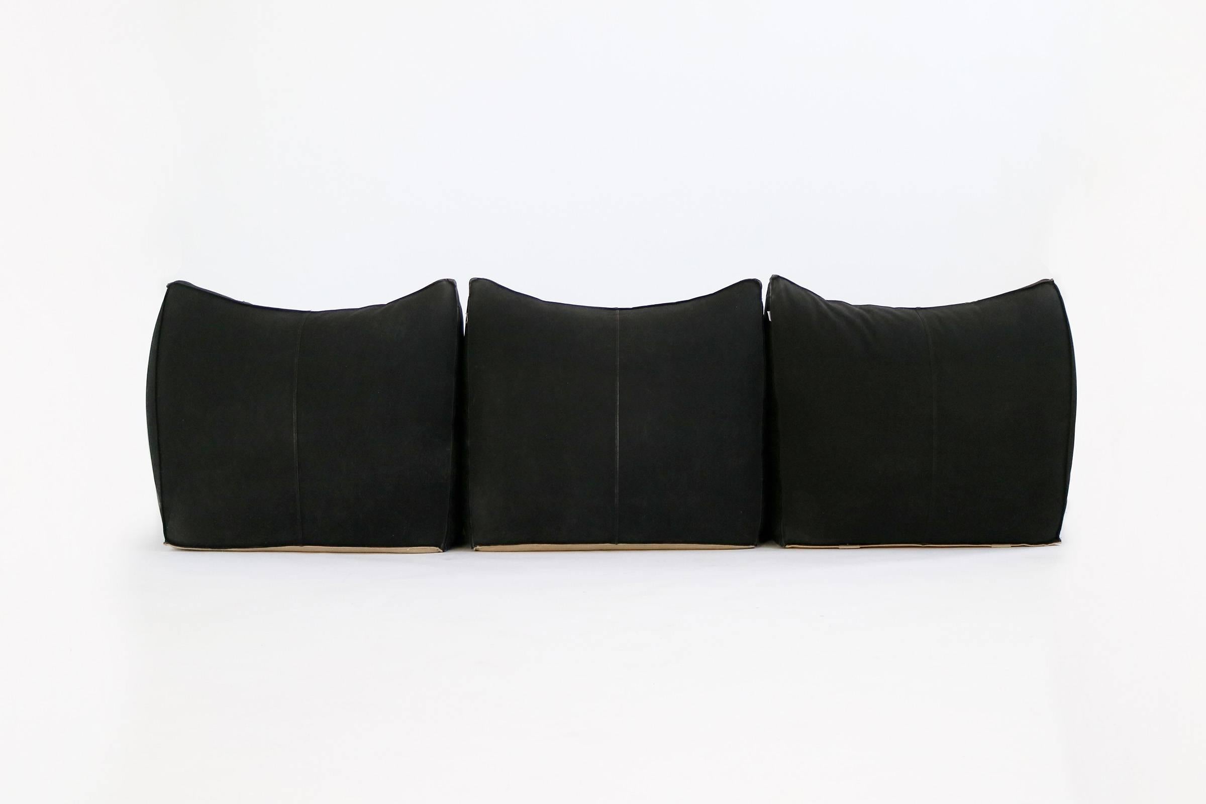 Bellini's Le Bambole series received the Compasso d'Oro in 1979.
Signed with manufacturer's mark to underside: [B&B Italia Modelo Le Bambole Designe Mario Bellini].

Two 3-piece black canvas sofa sets. Can be arranged to make an L shaped