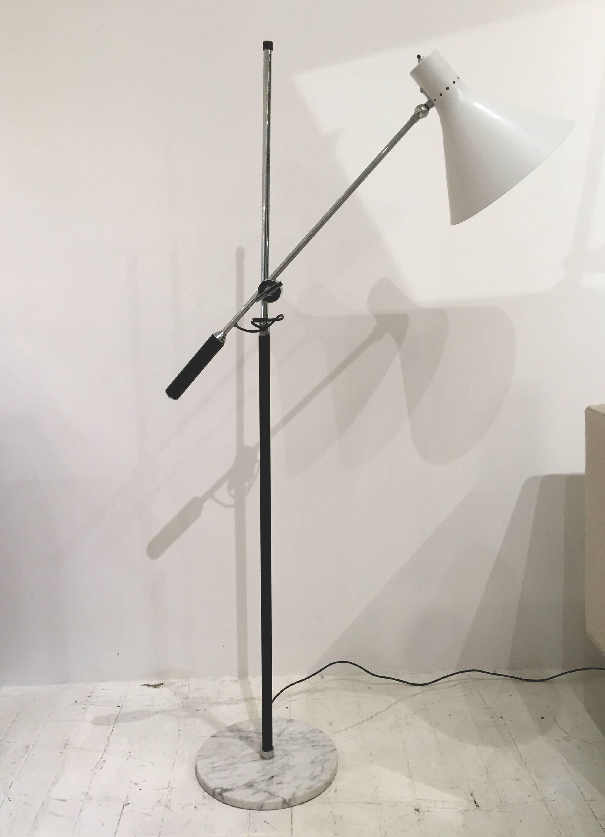 Articulating floor lamp by Arredoluce 1950s-1960s. 
Enameled metal, chrome, leather accent on handles and marble bases.
Two available. Can be sold as a pair or separately.

This item is currently on view in our NYC Greenwich Street Location.