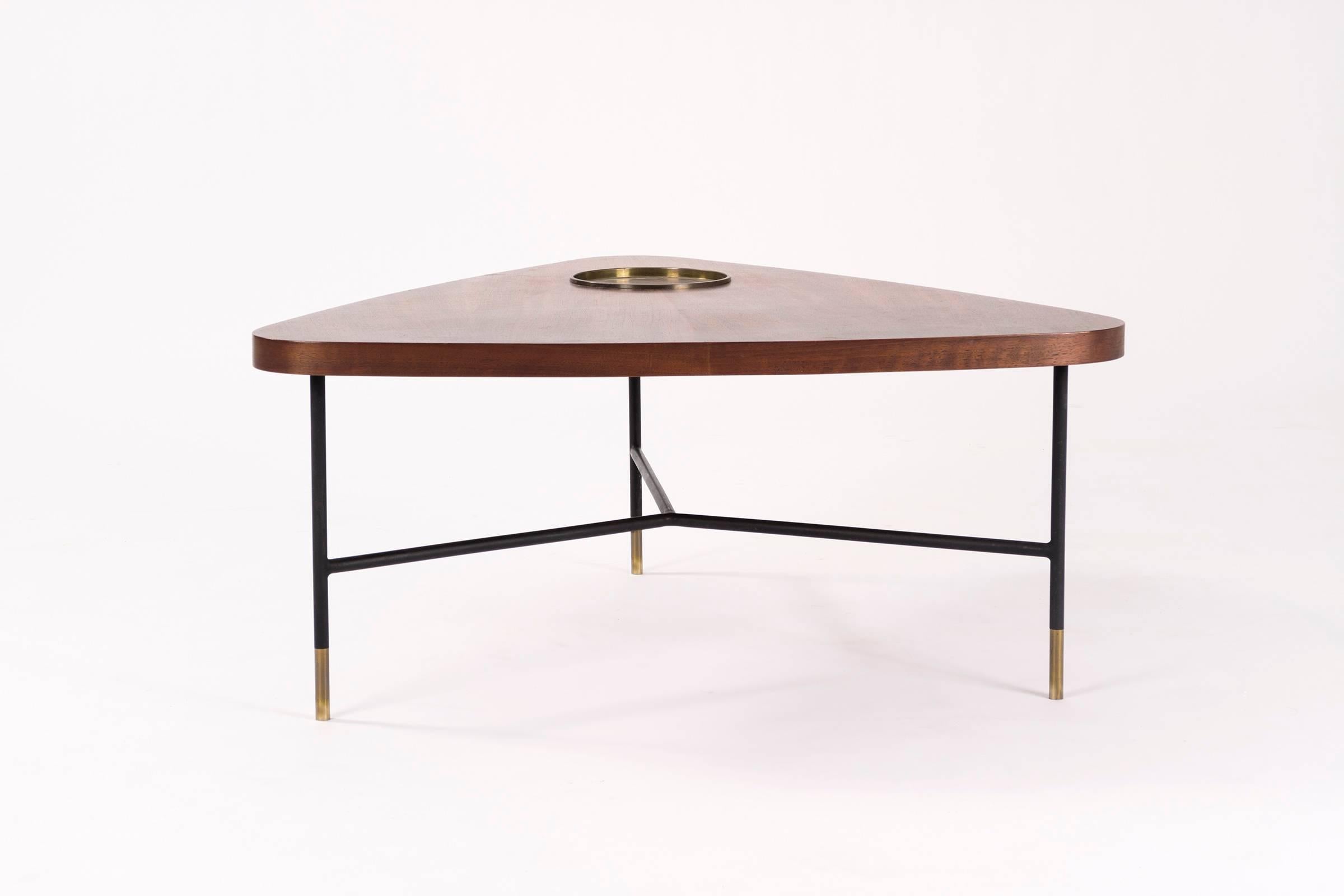Solid walnut top with excellent accents of fiddleback. Circular bronze tray inlaid to the wood. Black painted solid steel base with brass feet.