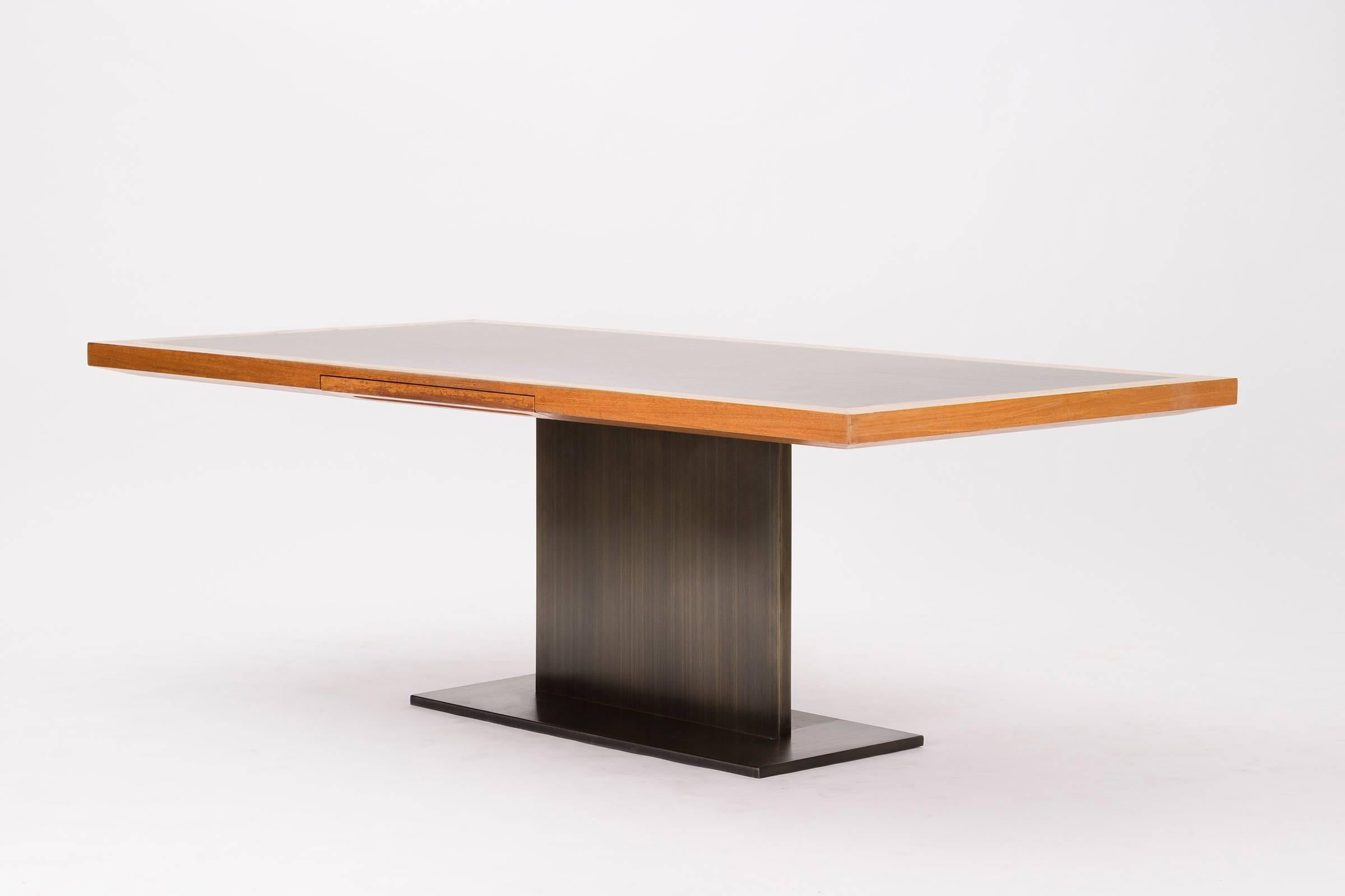 Platner for Lehigh Leopold desk, features single pencil drawer with walnut top and laminate surface, bronze base.