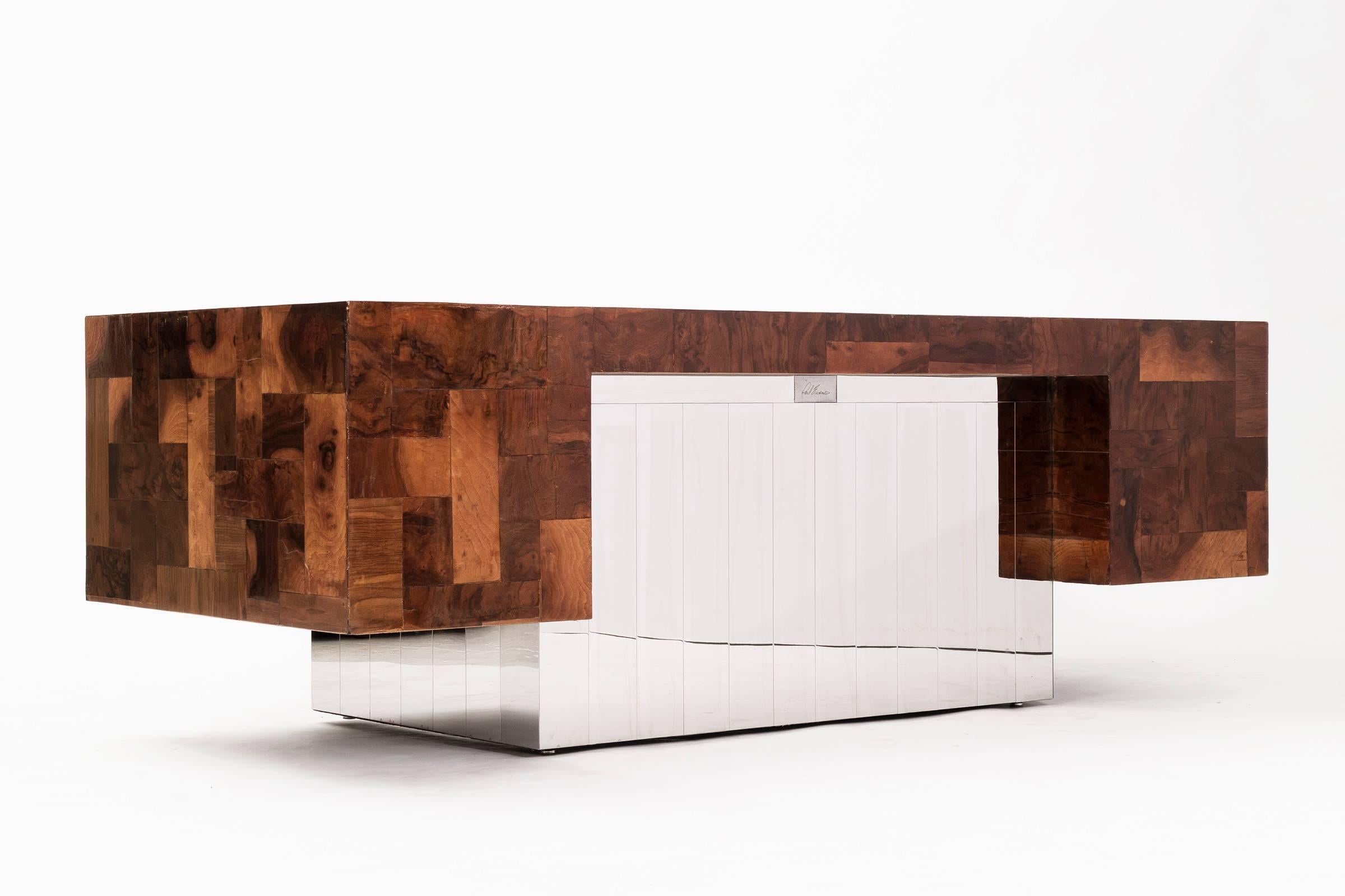 Paul Evans for Directional. Desk for Cityscape series. 
Features seven drawers, one file drawer.
Front and back finished with vertical chrome-plated slats, with olive and burl wood tiles.

This item is currently on view in our NYC Greenwich Street