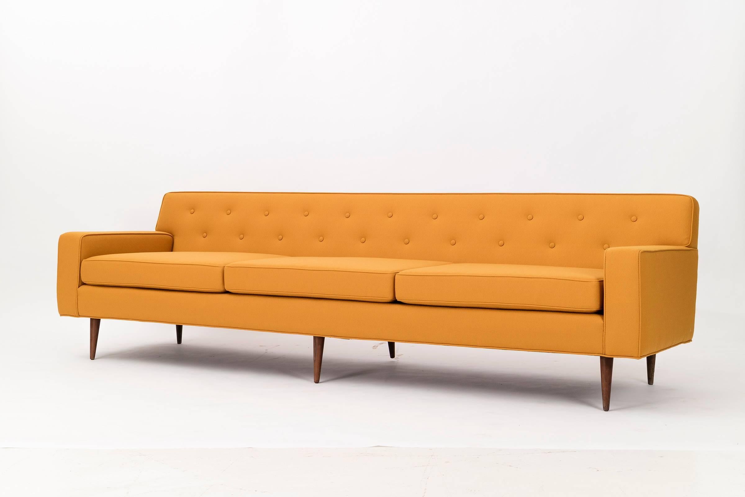 Baughman, three-seat sofa, tufted button backs with walnut legs.
Can be sold individually.
Reupholstered with Maharam Topas 100% wool, high quality durable crepe.