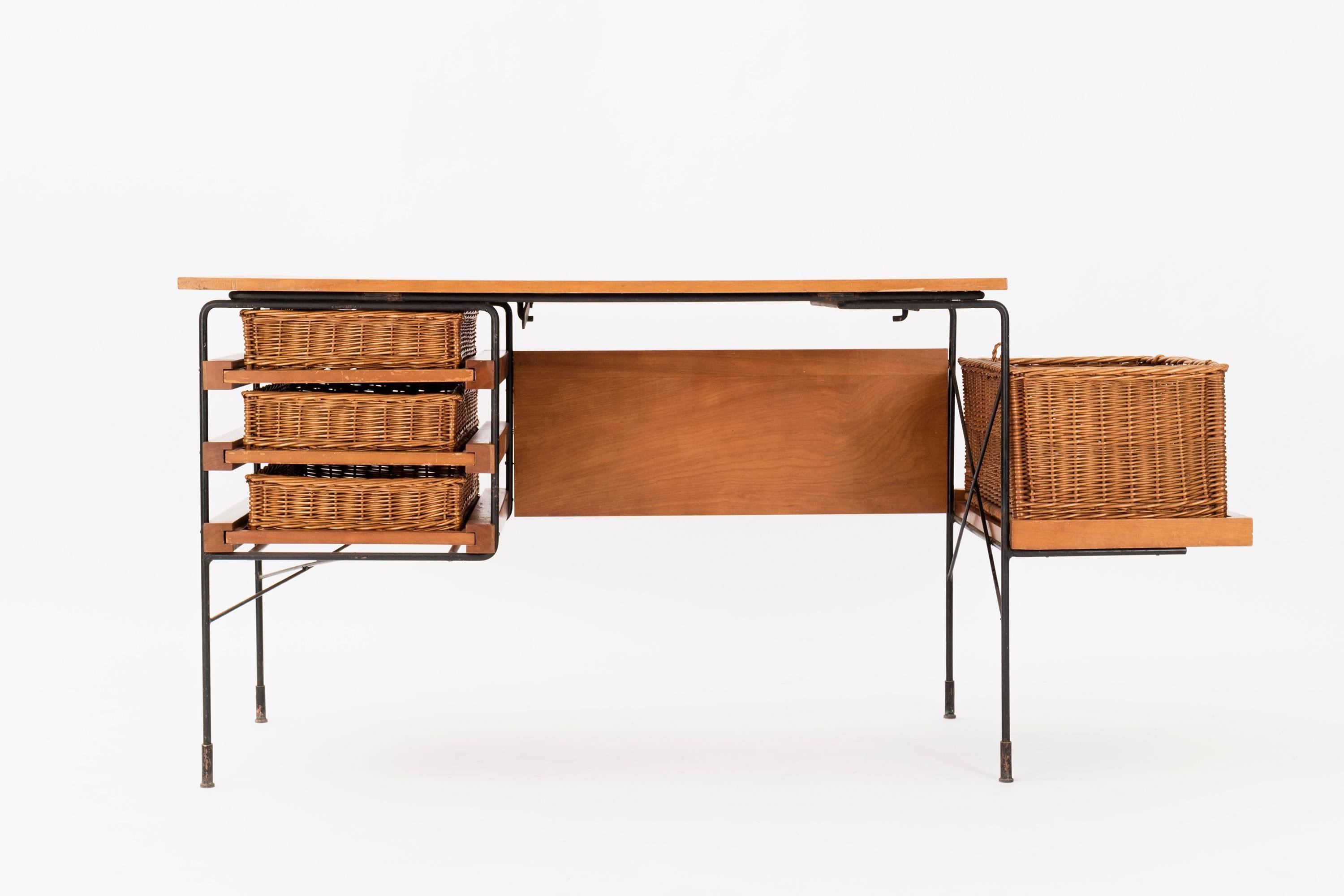 Dorothy Schindele desk for Modern Color, adjustable 4 position desktop with three drawer storage, one open storage box, (missing lid) maple wood, wrought iron and cane.