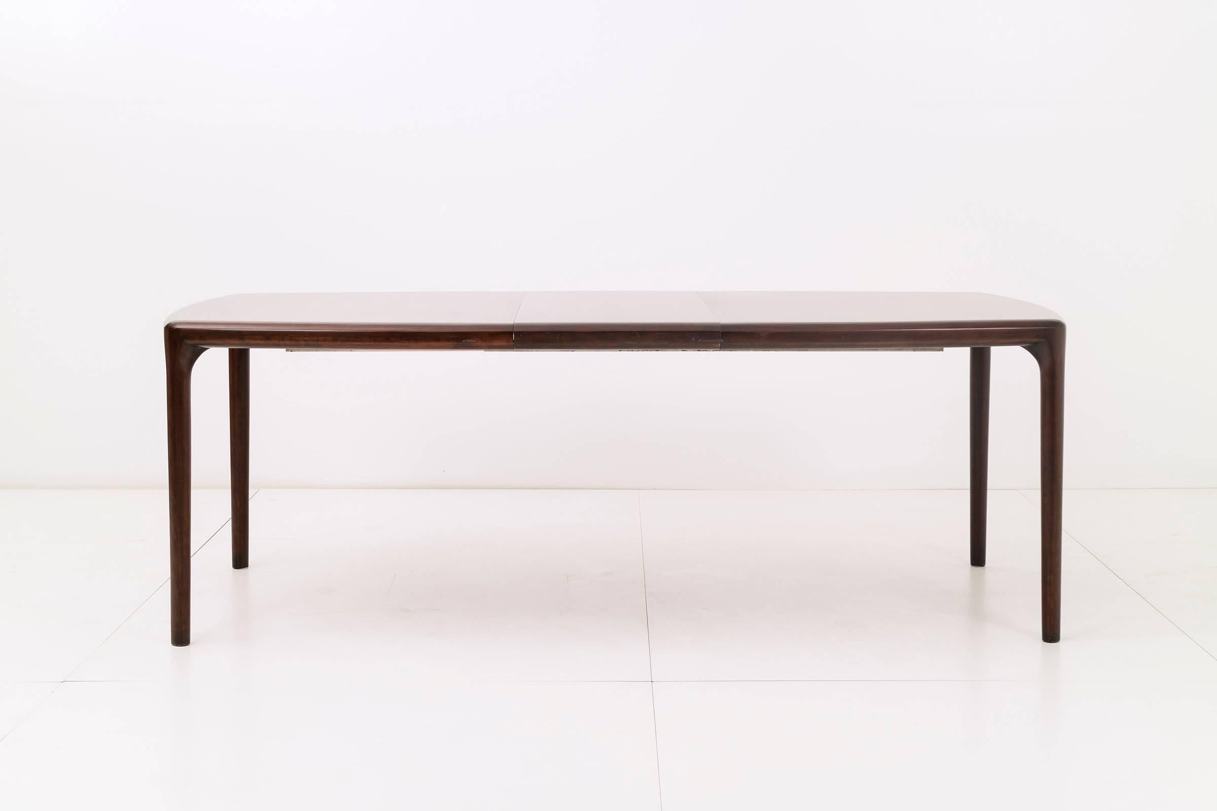 Solid mahogany dining table by Dunbar. This table has two18 in. leaves for a total length of 102 in.
Image 9 showing complex skilled joinery.
Signed Dunbar.
 
This item is currently on view in our NYC Greenwich Street Location.