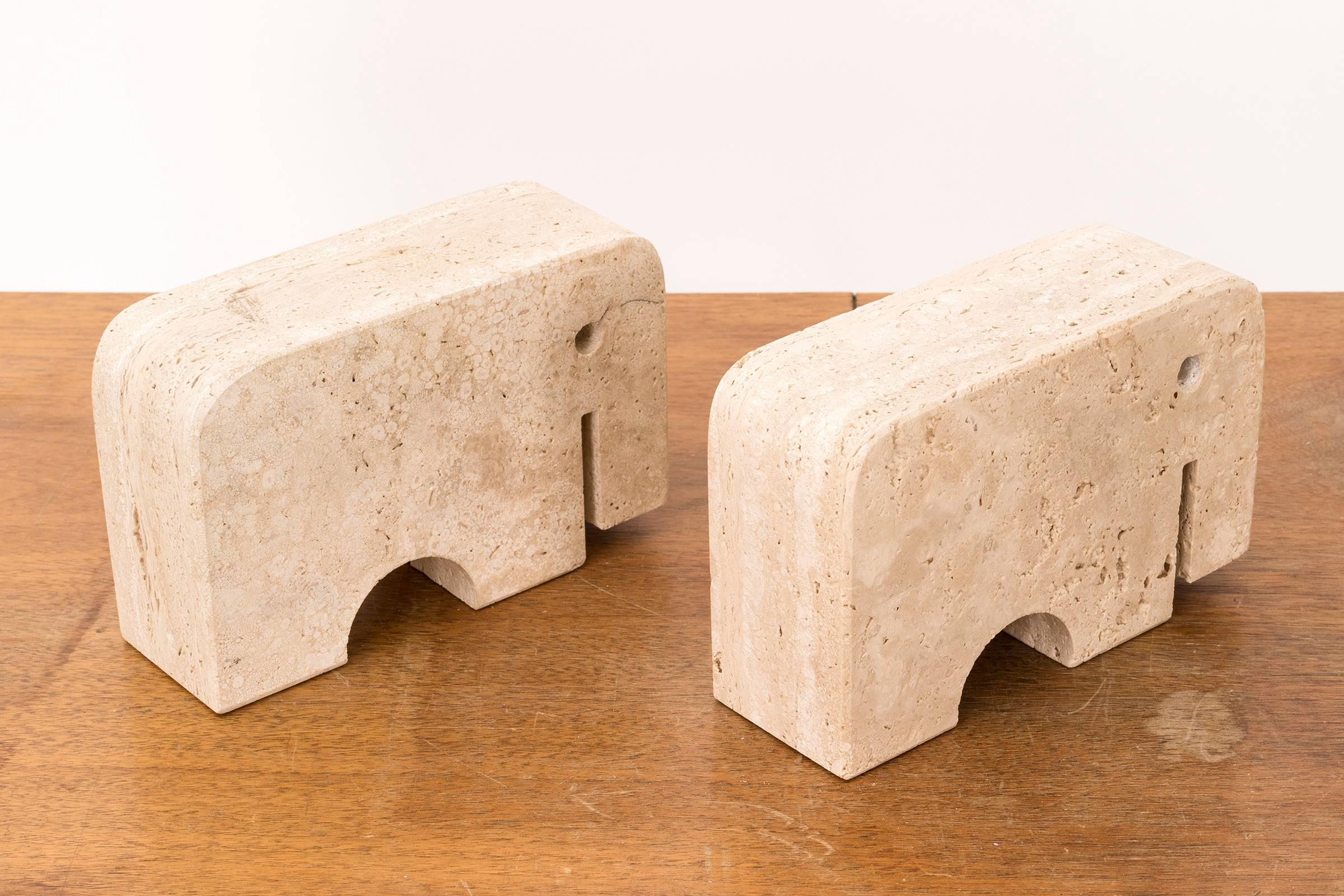 Pair of sculpted travertine elephant bookends.