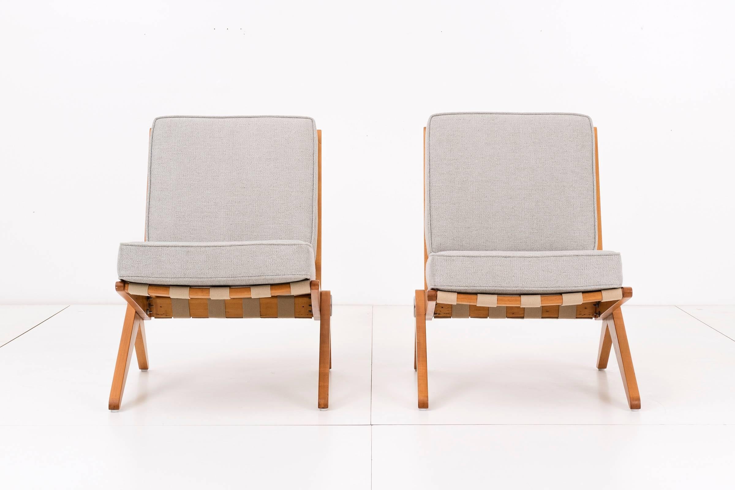 Pierre Jeanneret for Knoll International. Model 92. Solid birch chair frame with linen straps to hold loose cushions in place. Cushions have been reupholstered.