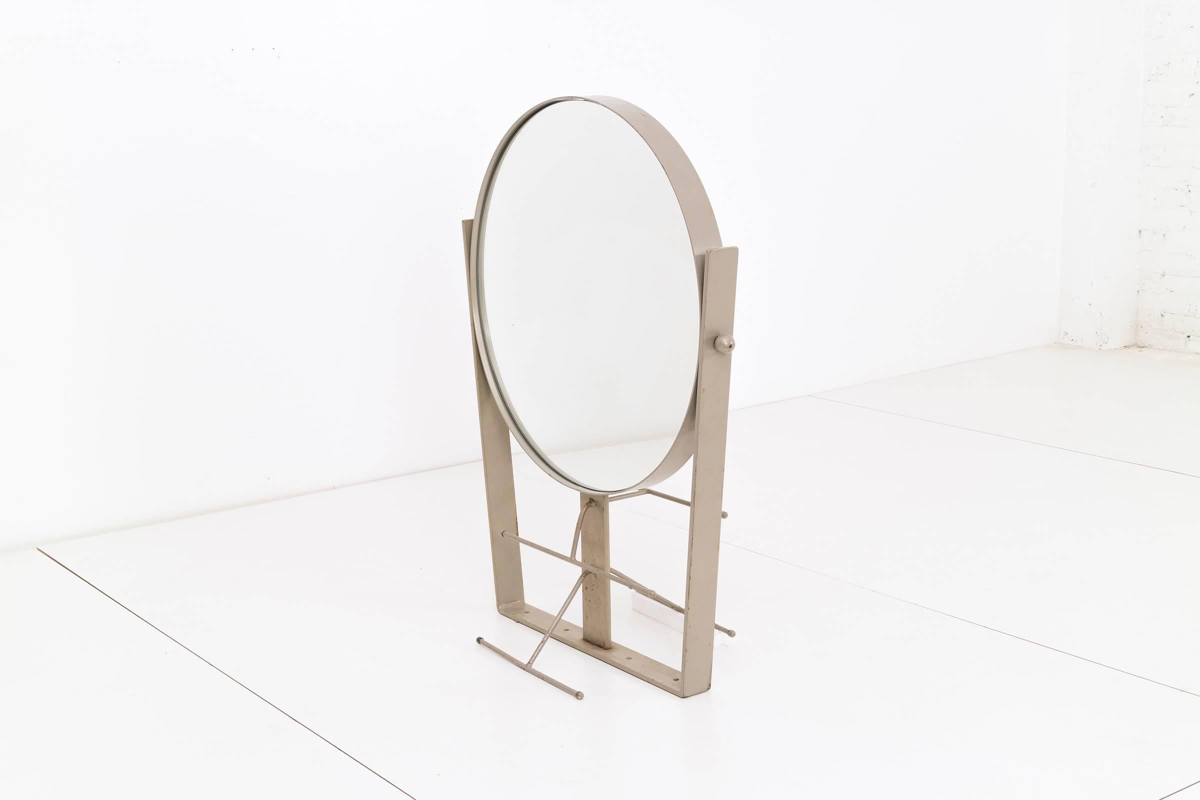 Naval mirror, heavy gauge metal with large two-sided round mirror, can be secured on most surfaces and or walls.
 