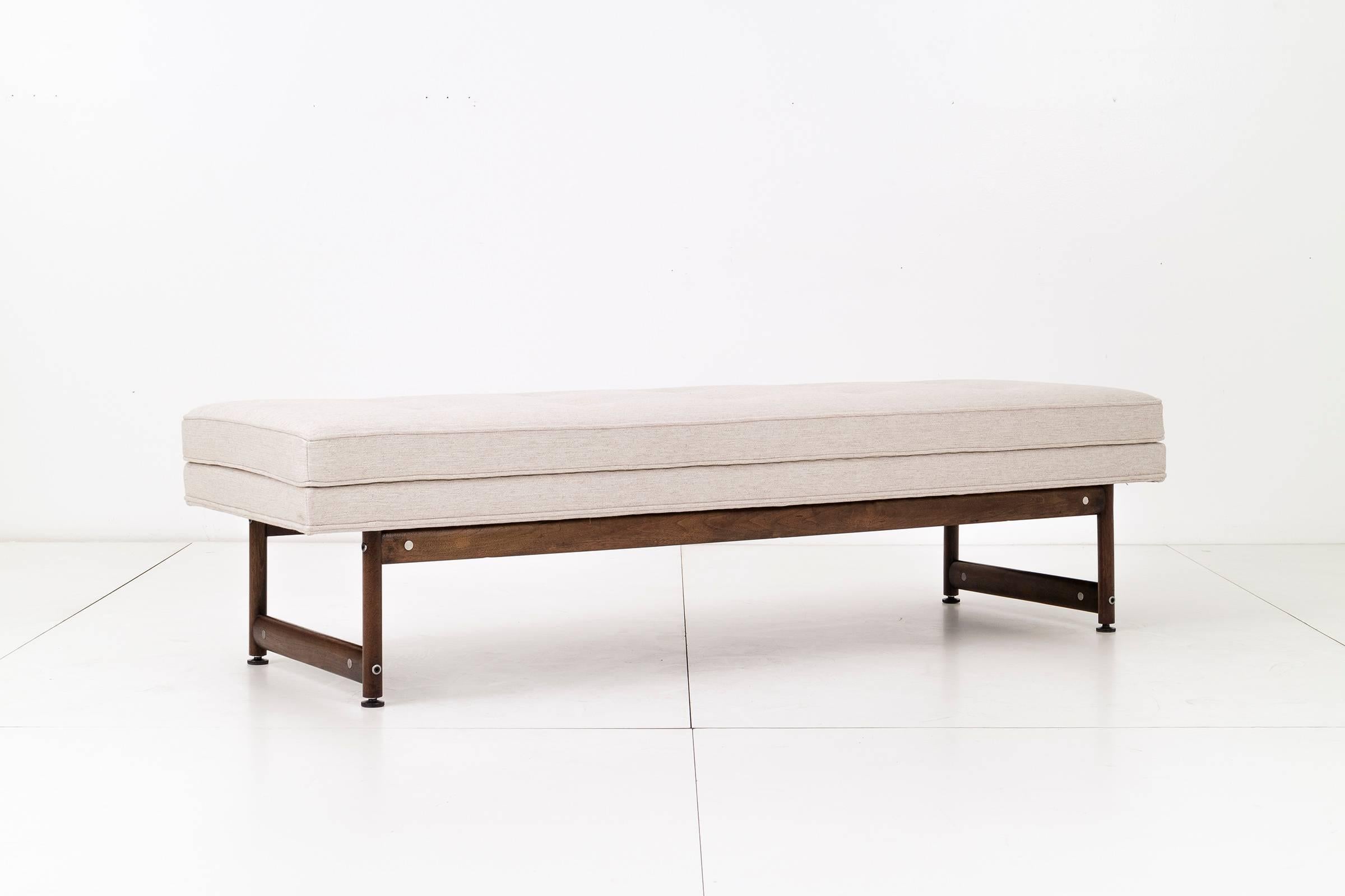 Kasparian Brothers, California modern long bench, reupholstered with great plains cotton-poly textured weave and solid oiled walnut base, metal discs highlights accent of structural joinery.

 