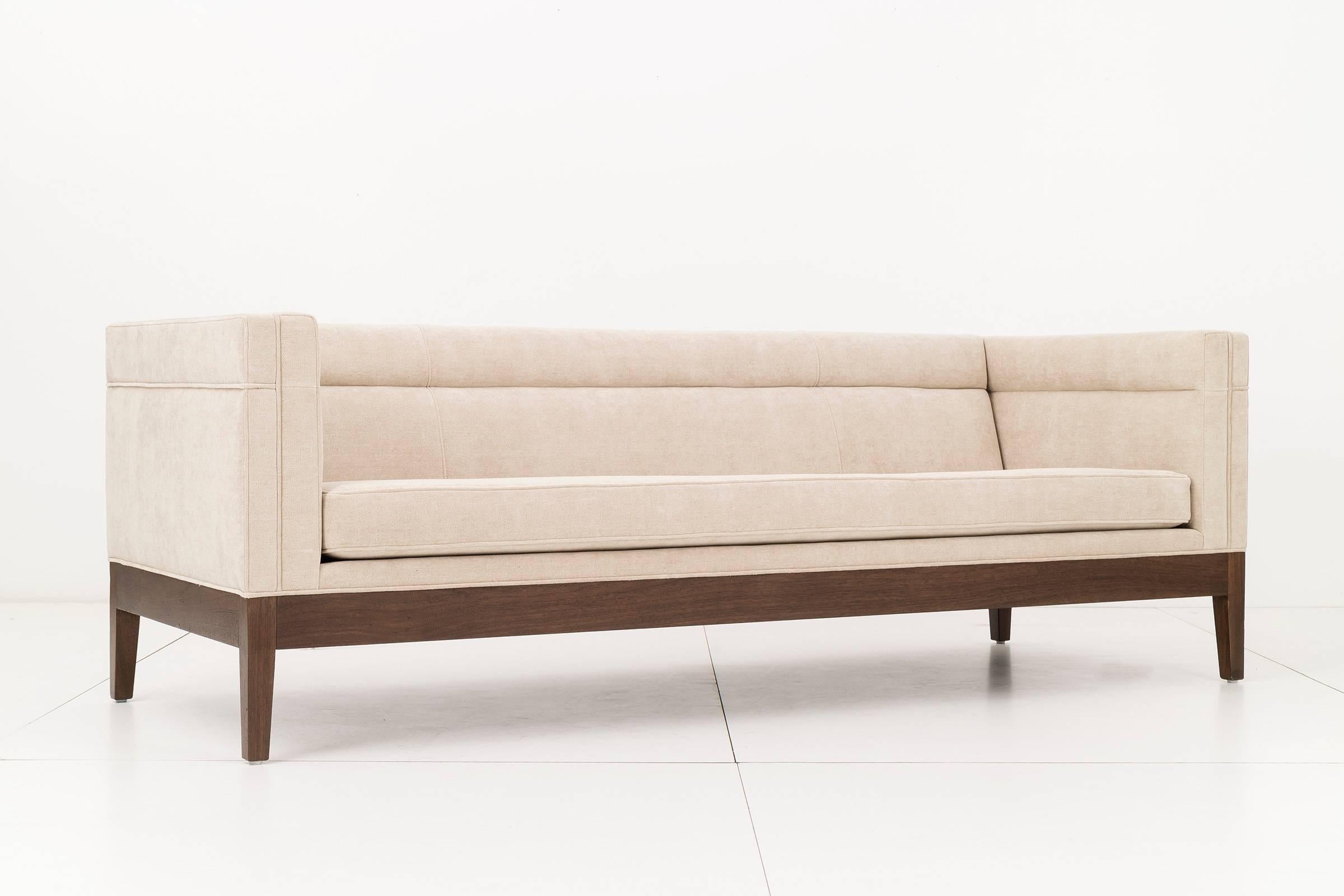 Holly hunt sofa with channeled back, reupholstered with mohair and walnut legs.
       