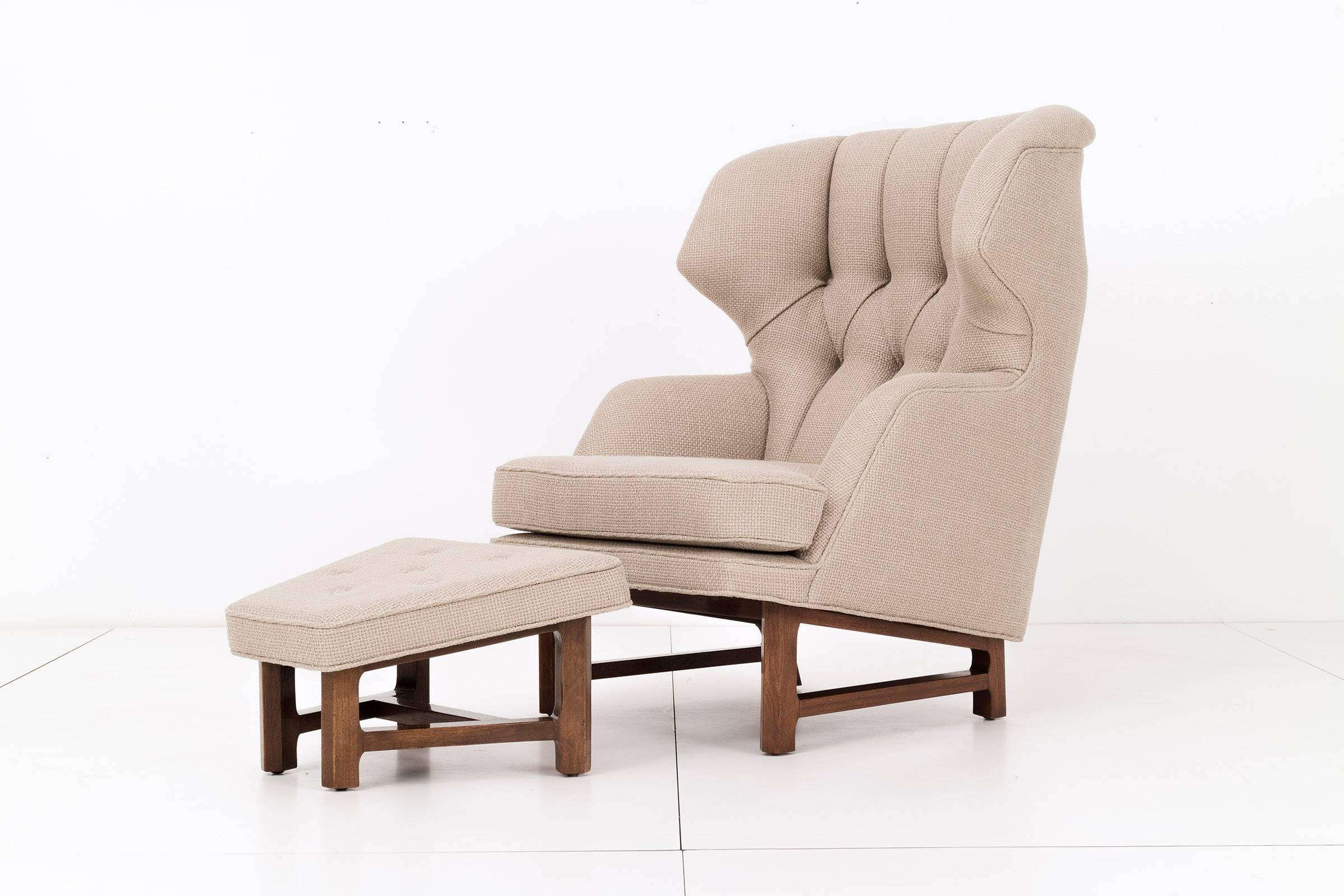 Wingback lounge chair and ottoman designed by Edward Wormley for Dunbar.
Diamond tufted back, reupholstered with Great Plains high quality woven wool fabric.

Lounge chair measurements:
34 D x 30 W x 41 H x 18 SH in.

Ottoman measurements:
18