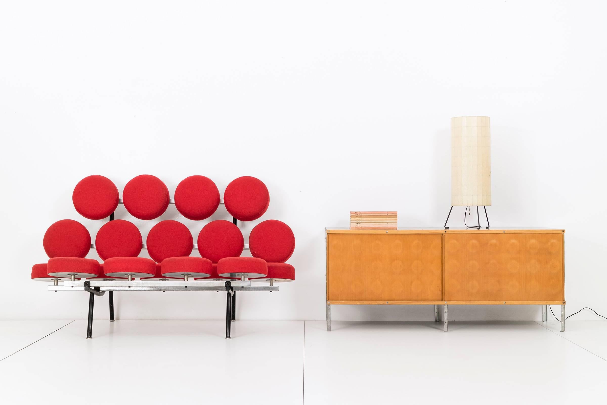 One of the most iconic designs of the Mid-Century Modern movement.
Irving Harper leads the team of Nelson design associates with this playful and innovated sofa.
Original Girard red wool hopsack.
Disc label underside Herman logo Designed by