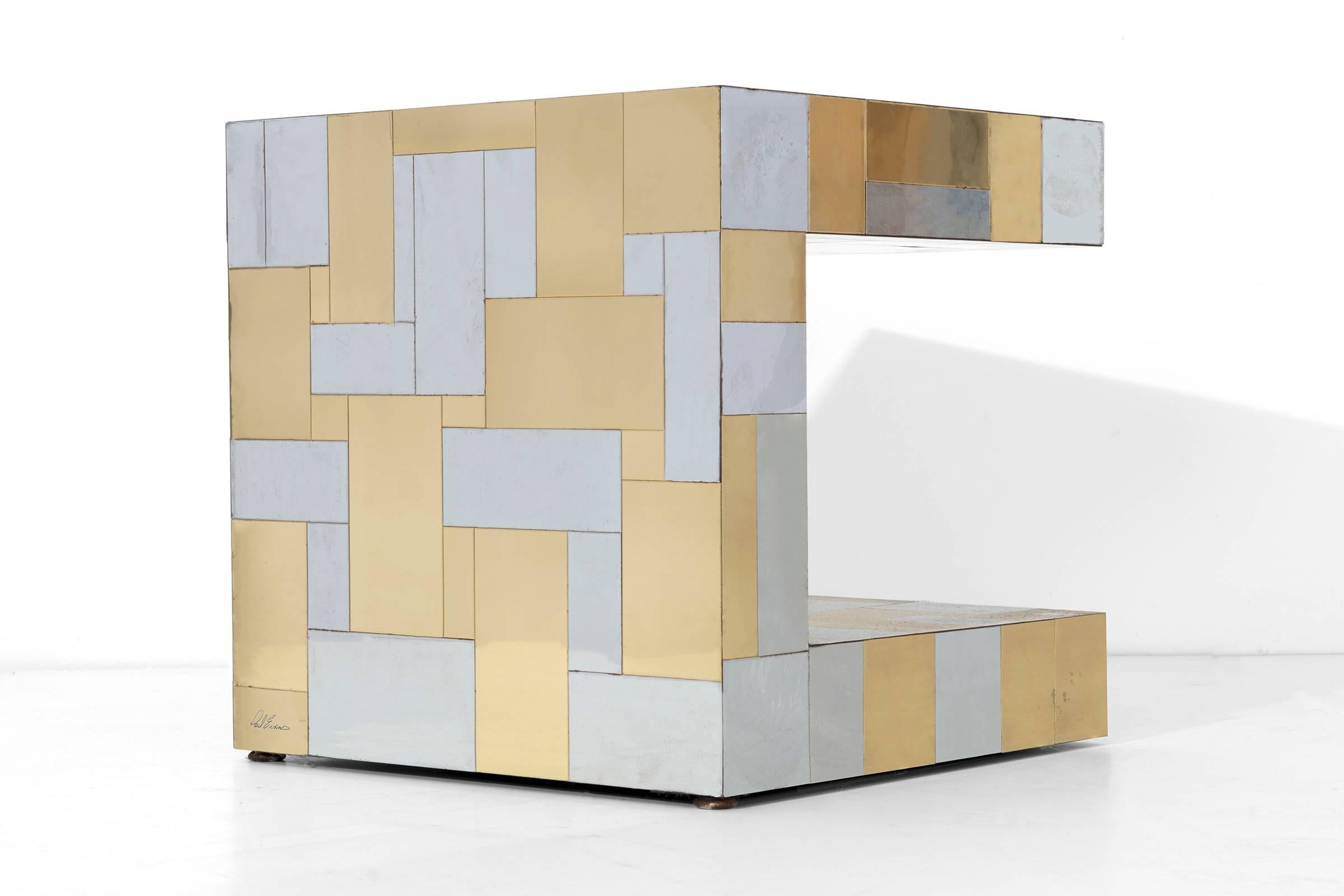 'C' shaped Paul Evans Cityscape side table, covered in polished steel and brass tiles.