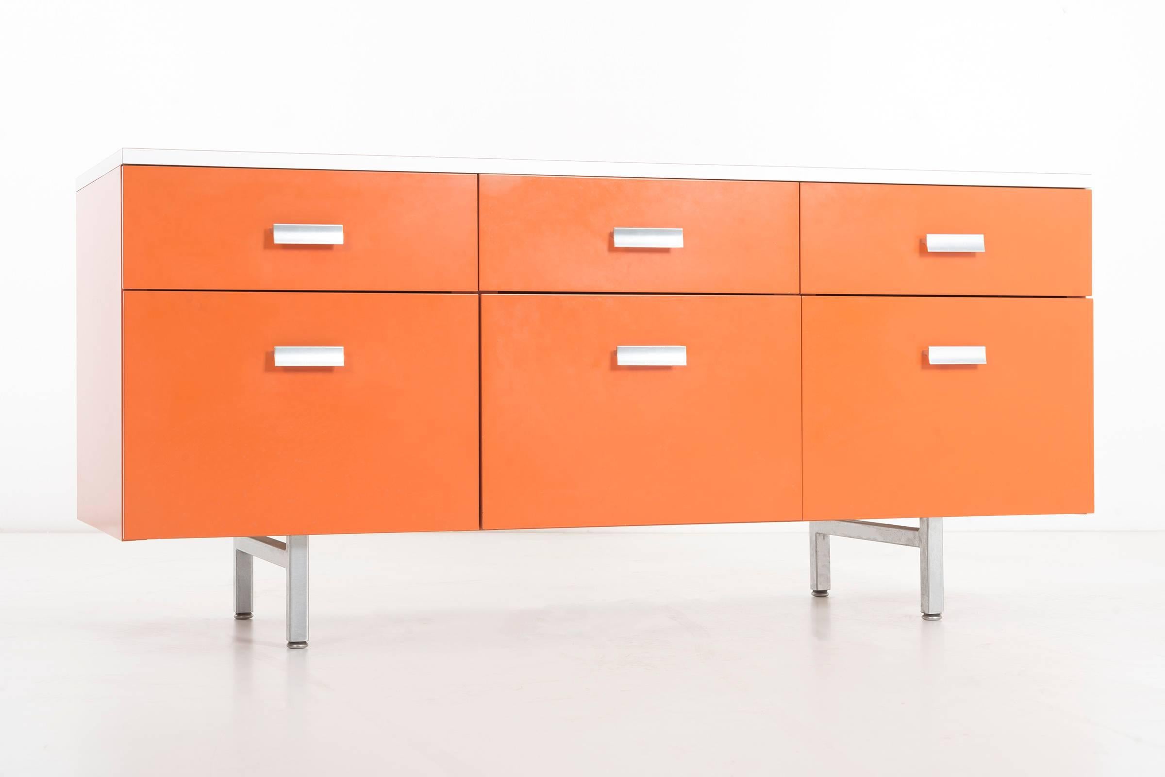 Nelson design for Herman Miller, Modern Management Group (M.M.G.), 6 drawer case in tangerine with white laminate top.
This series was designed to add a color palette to interiors rather then depending on wall and window treatments.
The production