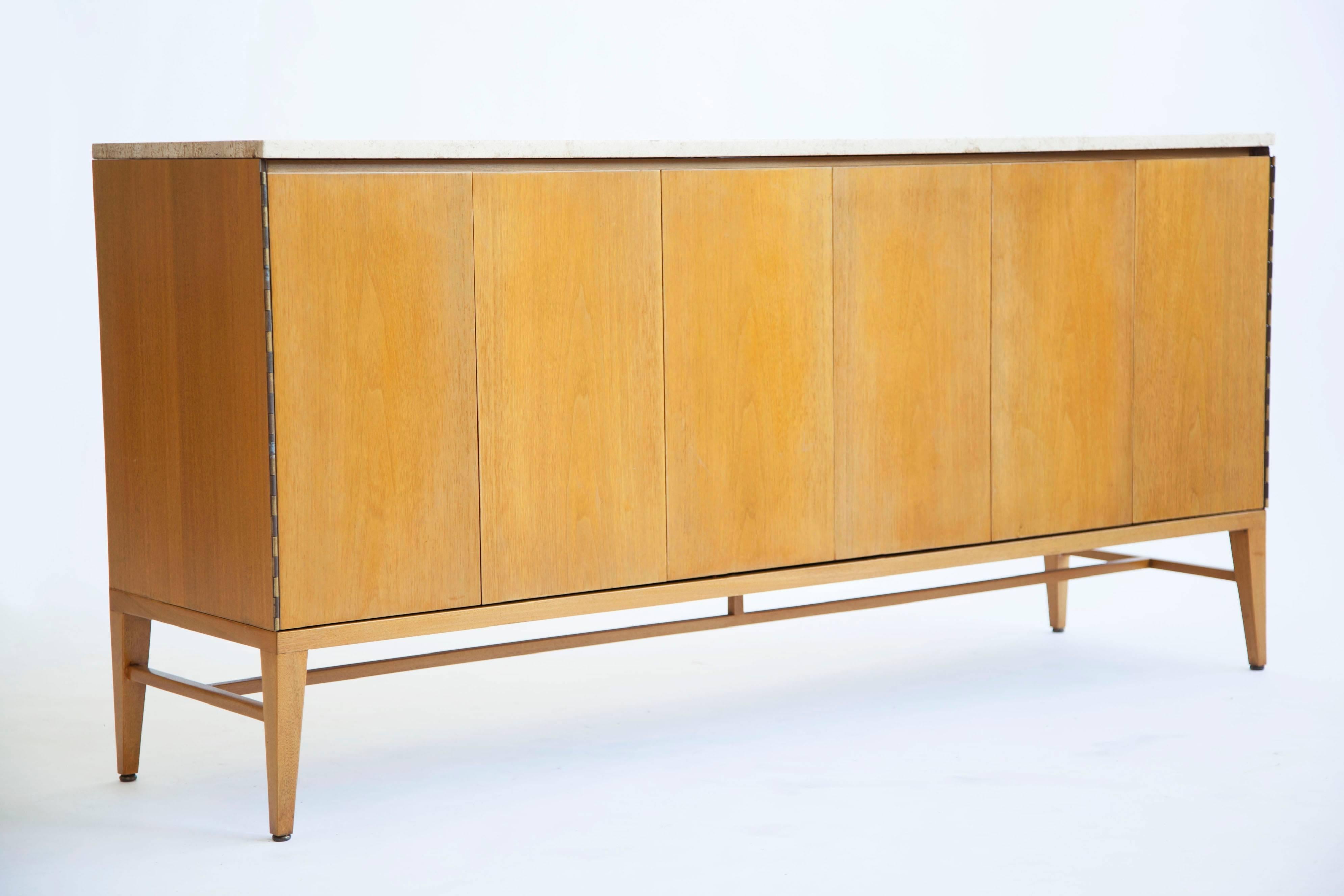Paul McCobb side board for Calvin-The Irwin collection walnut case, finished on back, walnut body and travertine marble top, accordion folding doors open concealing two pull-out drawers, and two shelves, brass interior details, brass hinged doors.