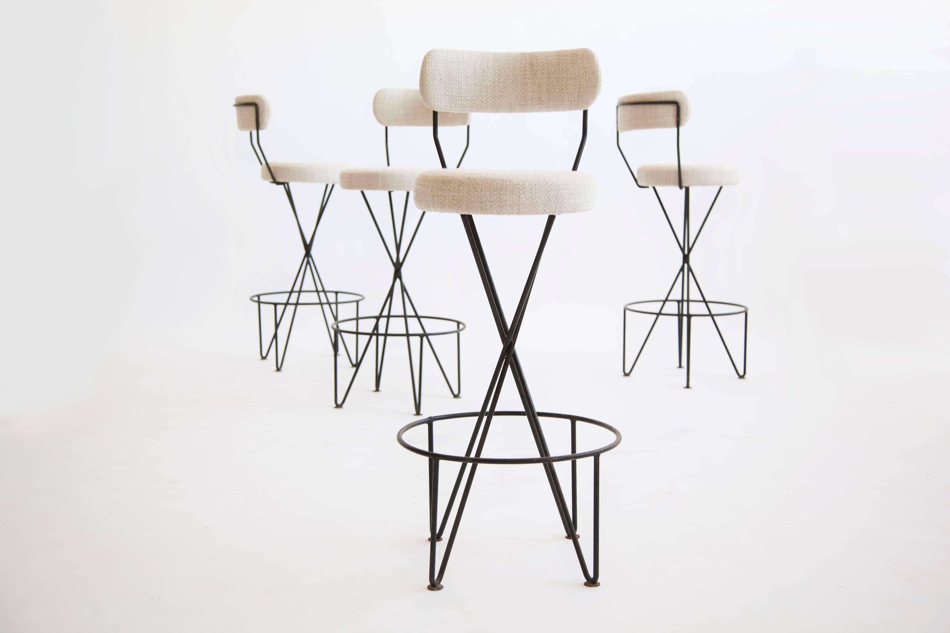 Tony Paul wrought iron and upholstered bar stools.
Reupholstered with woven cotton seats.