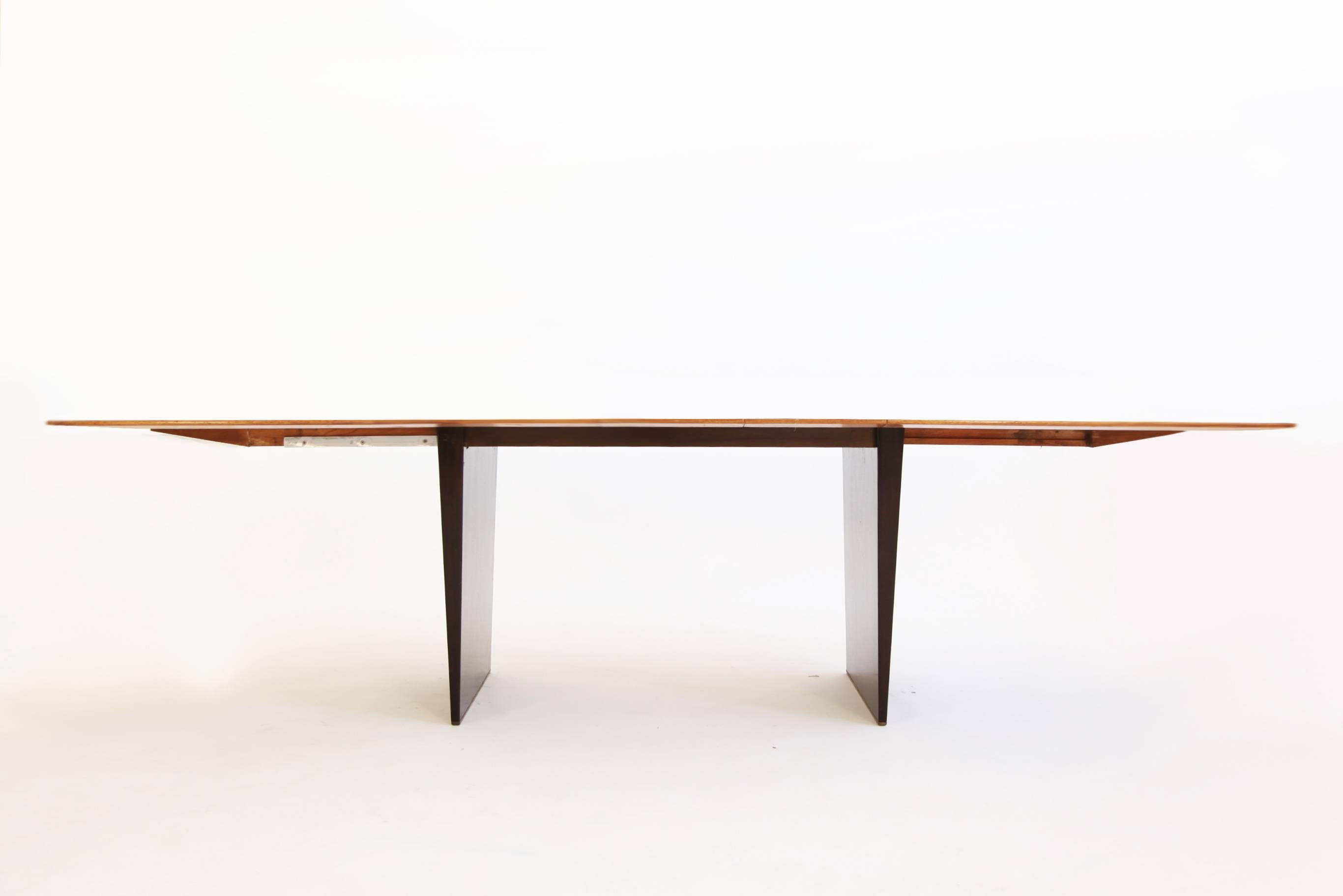 Wormley for Dunbar, boat shaped dining table, model 5460; tawi-wood top with mahogany base with solid brass glides.
Graining on top runs with length of the table, three leaves graining runs with depth showing intended contrast.
Three 12-inch