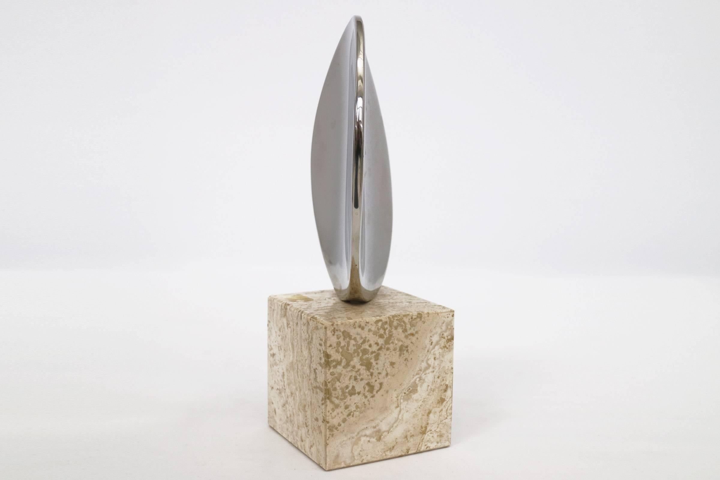 Unsigned nickel plated and travertine sculpture.