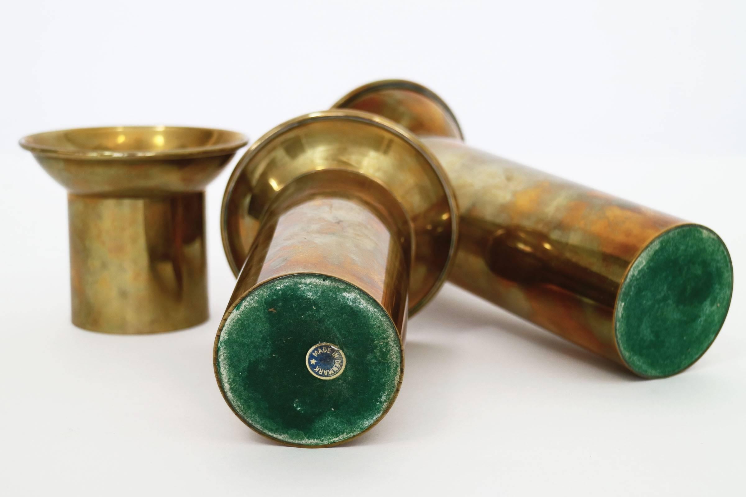Set of 3 different sized candle holders.  Made in Denmark sticker on underside.

Dimensions of medium sized candle holder
H: 5.5