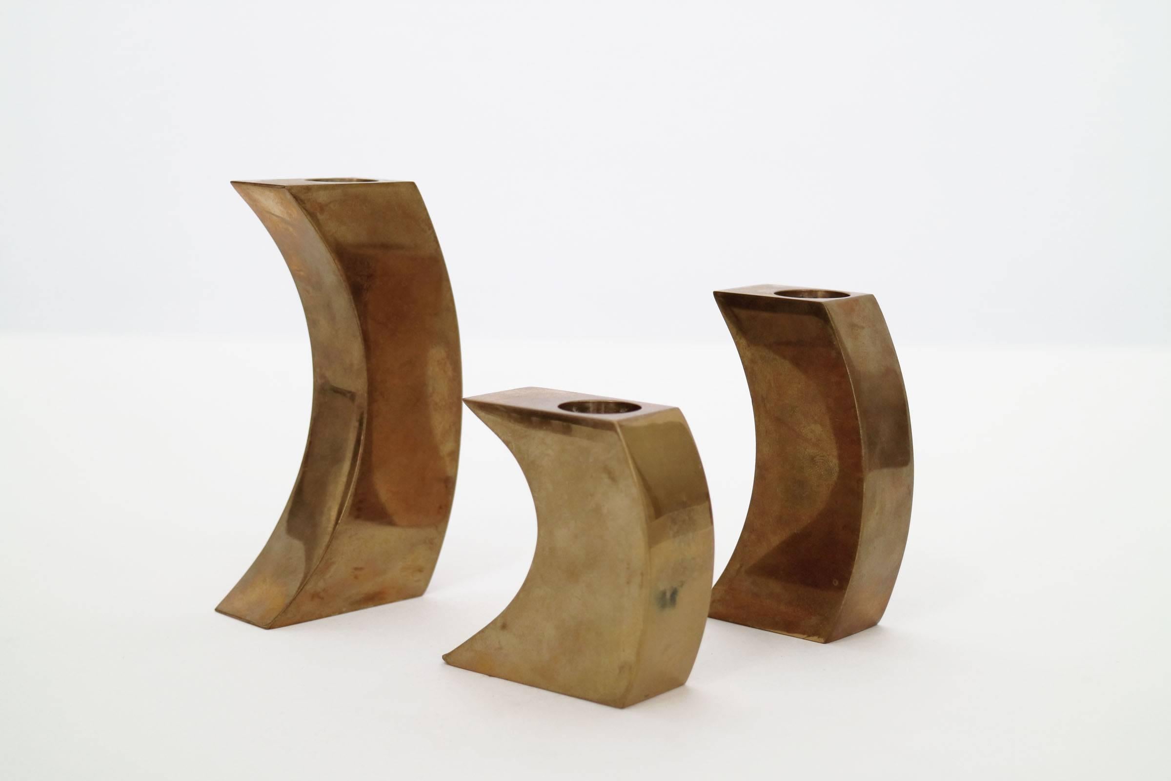 Polished brass crescent like shape, candle holders.

Solid Bronze Candle Holders;

Medium sized candle holder dimensions
H: 3.75