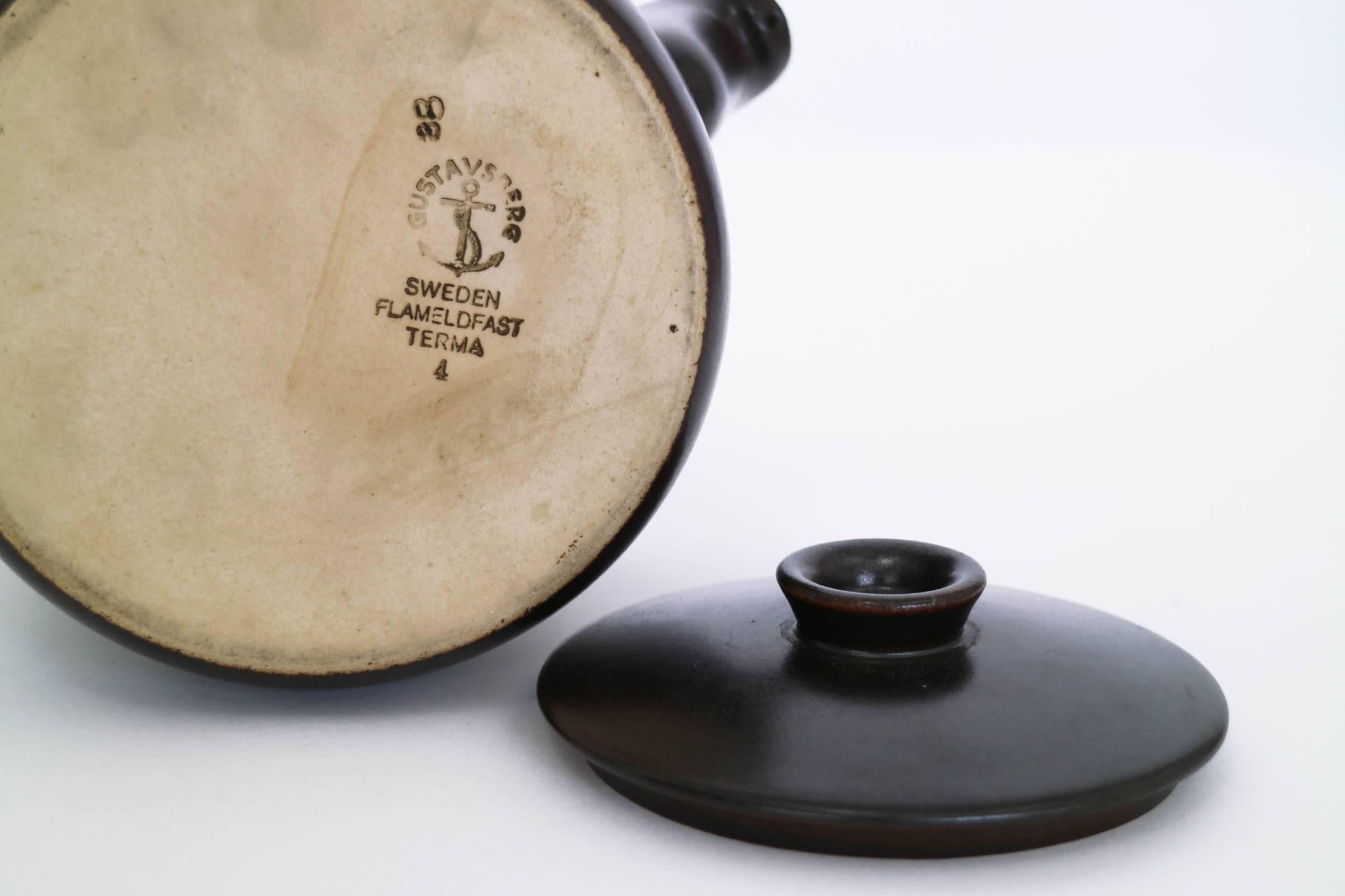 Glazed ceramic Terma series tea pot with bent bamboo handle.