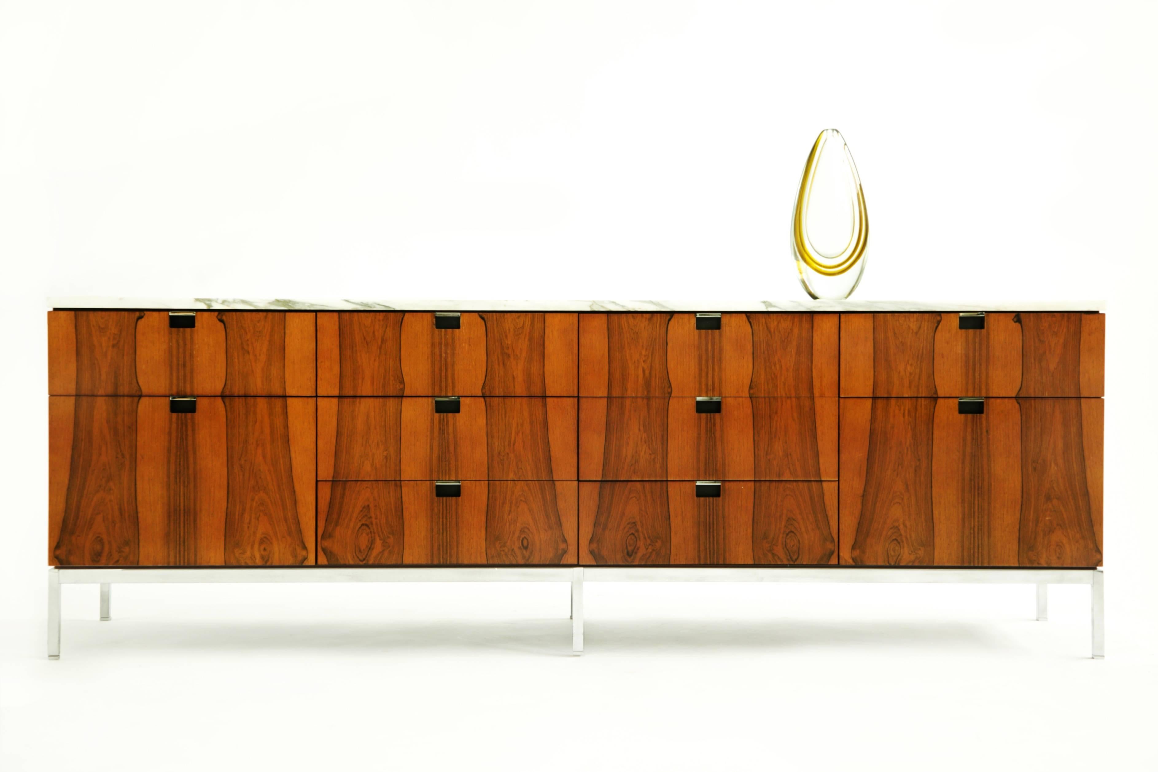 Florence Knoll rosewood and Calacatta marble cabinet; features eight drawers and two file drawers. 
Highly grained vertical pattern bookmatched rosewood. Chrome plated base with adjustable glides, lock with key.