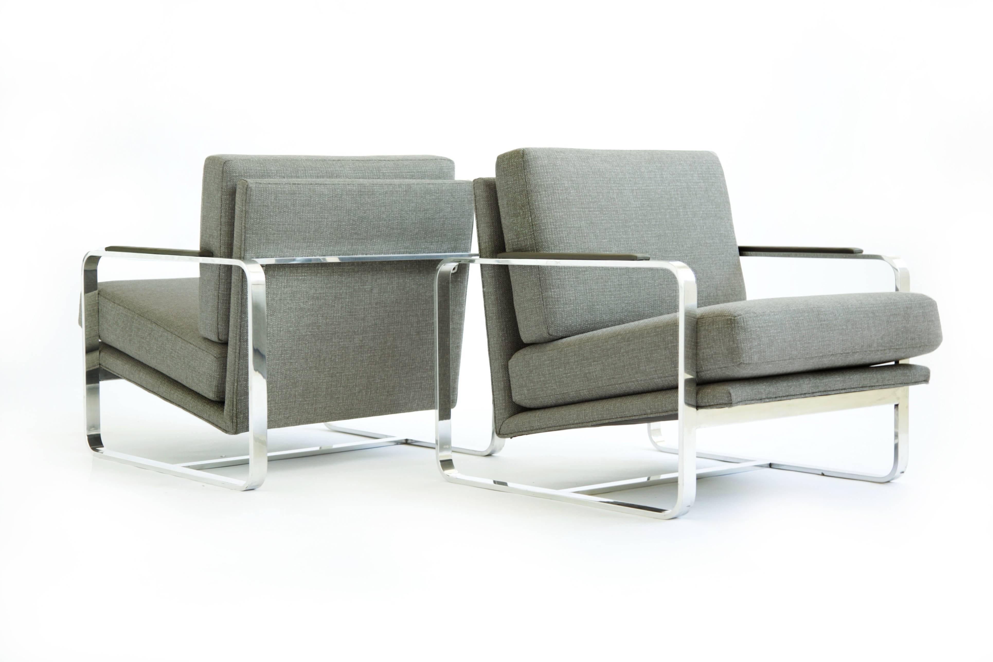 Milo Baughman style pair of lounges, stainless steel frames with new upholstery recovered in great plains cotton blend fabric, leather arm pads. 
Seat H: 16.5