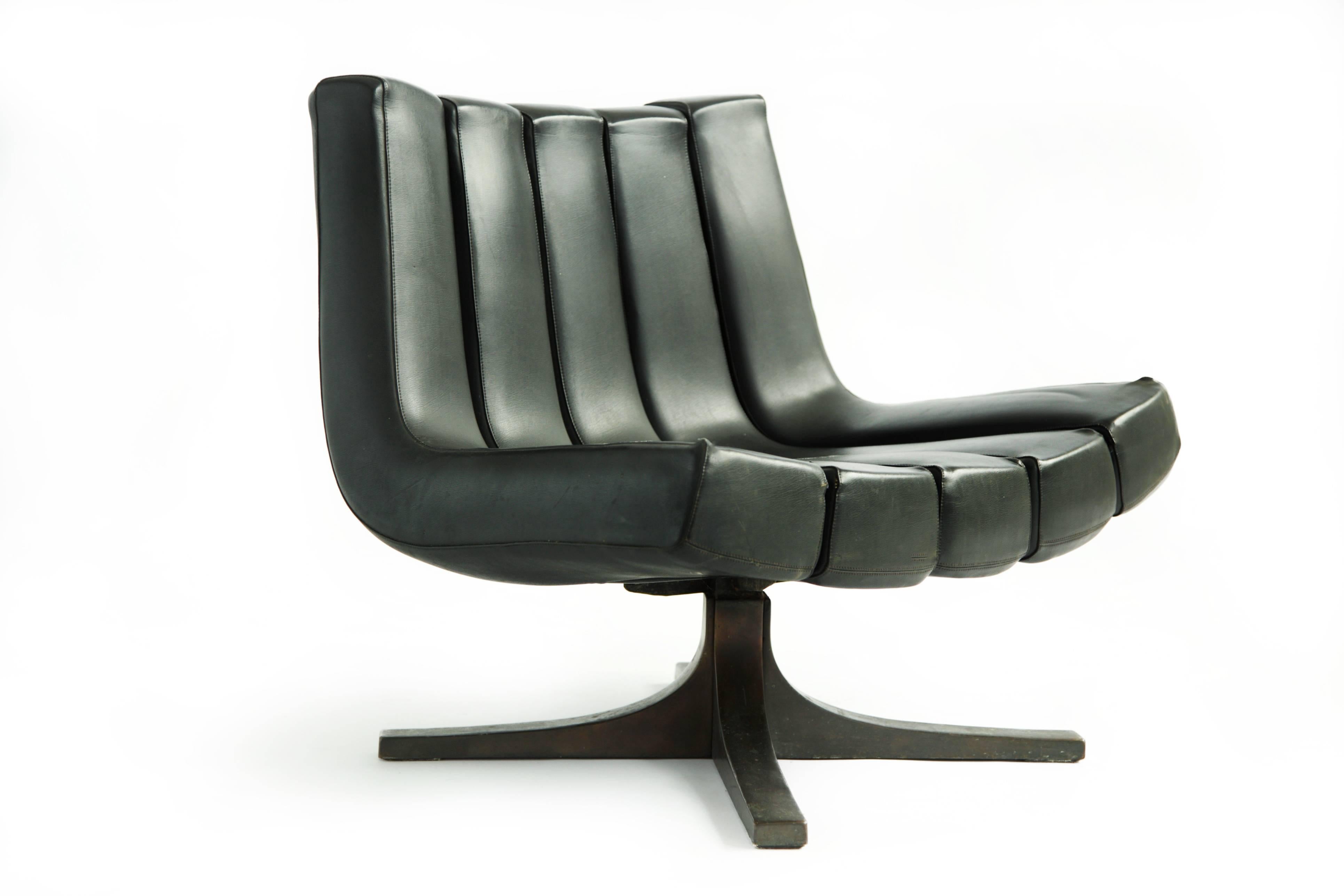 Channel lounge chair by Carvajal for JMM leather channels with bronze star base.
