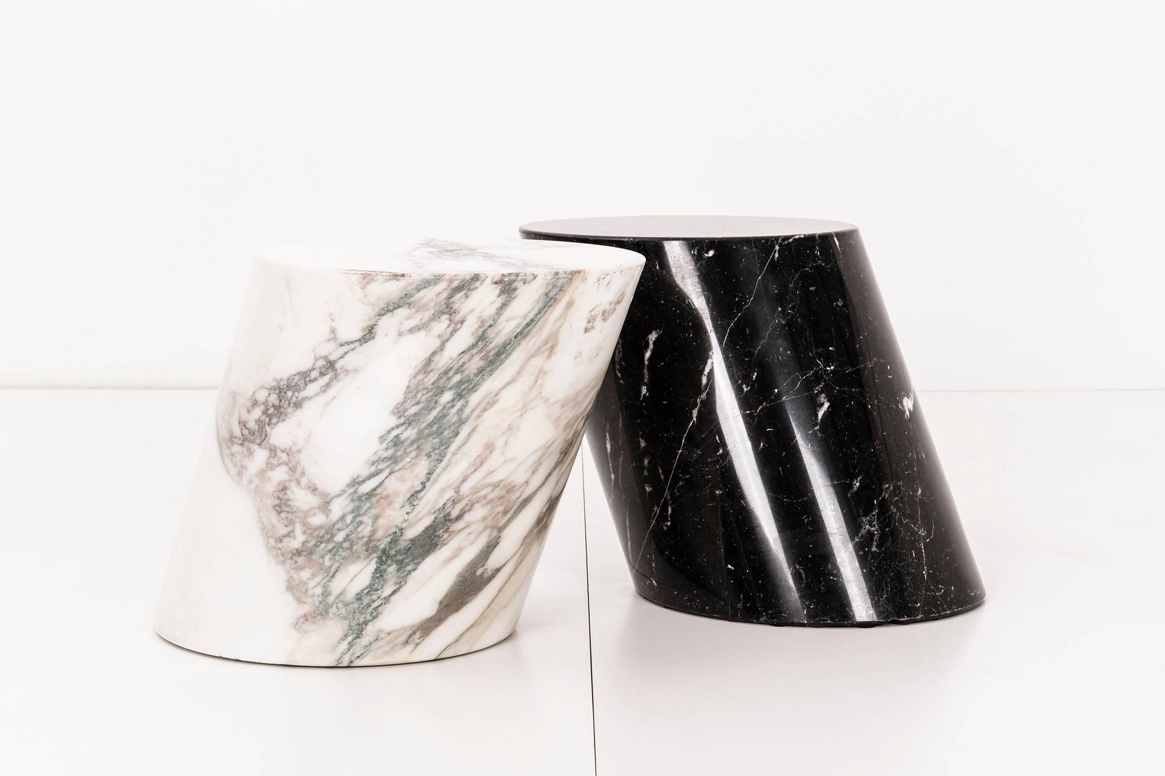 Solid marble stump tables. Nero Marquina and Calcutta gold. Dimensions posted below are of the table surface. The table as a whole has a depth of 21".
