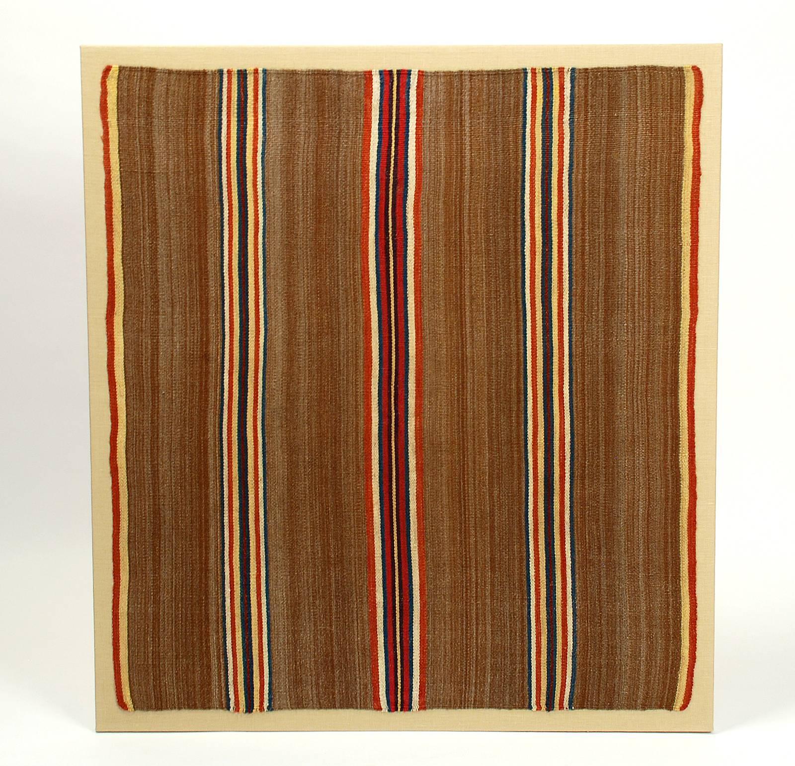 A stunning late 19th century Aymara ceremonial 'Tari' cloth (ceremonial ground shaman's cloth) from the Pacajes region of Bolivia, Department of La Paz - circa 1880. All natural dyes. Three channels of vertical stripes against a field of beautifully