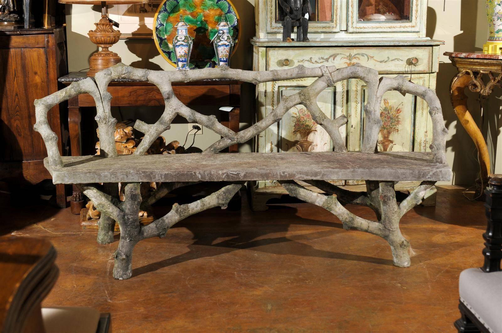 Contemporary French faux bois bench, carved to resemble wood, with a single bench.