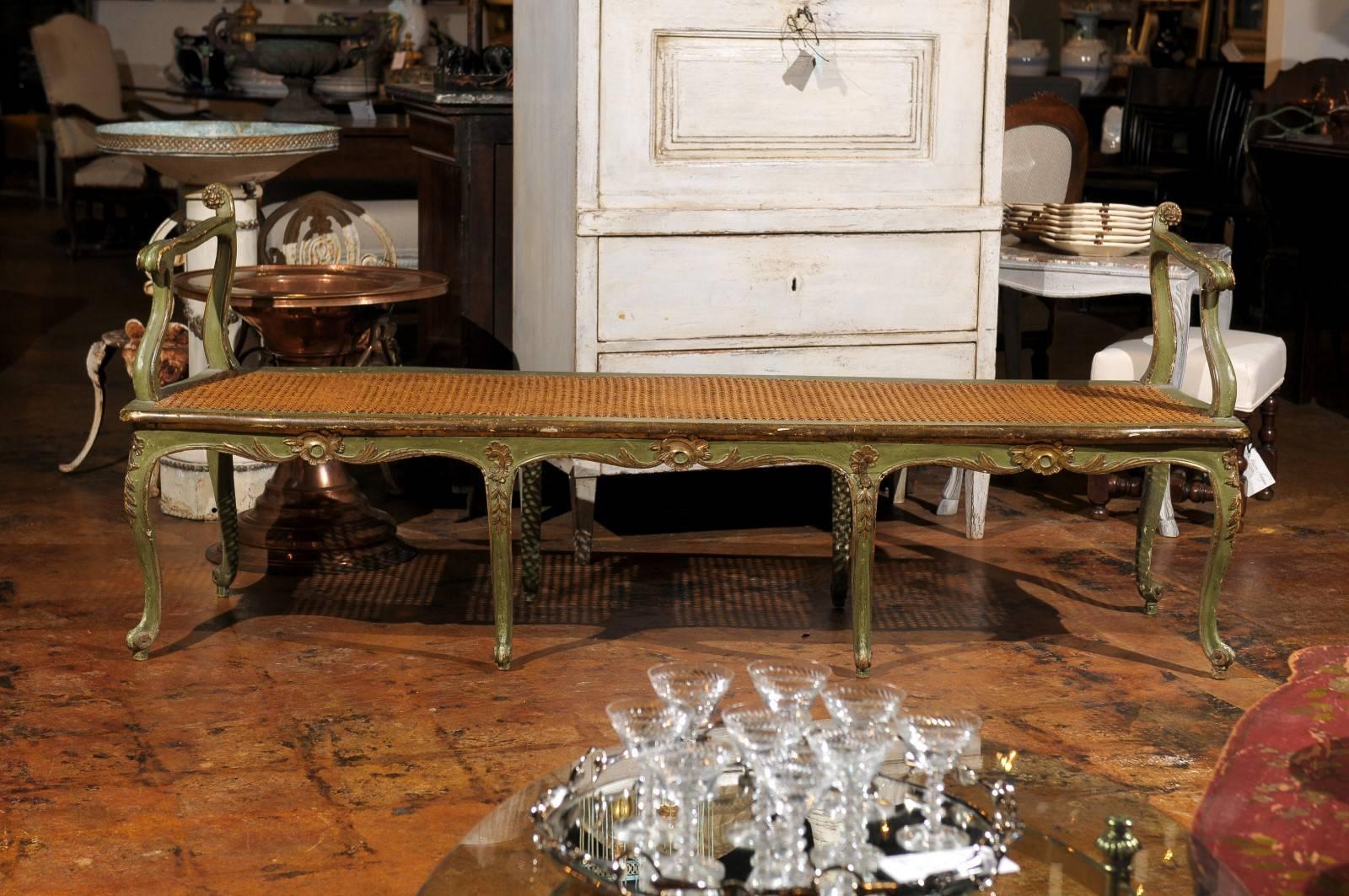 Late 18th century or early 19th century Italian gilt and polychrome bench with cane seat.